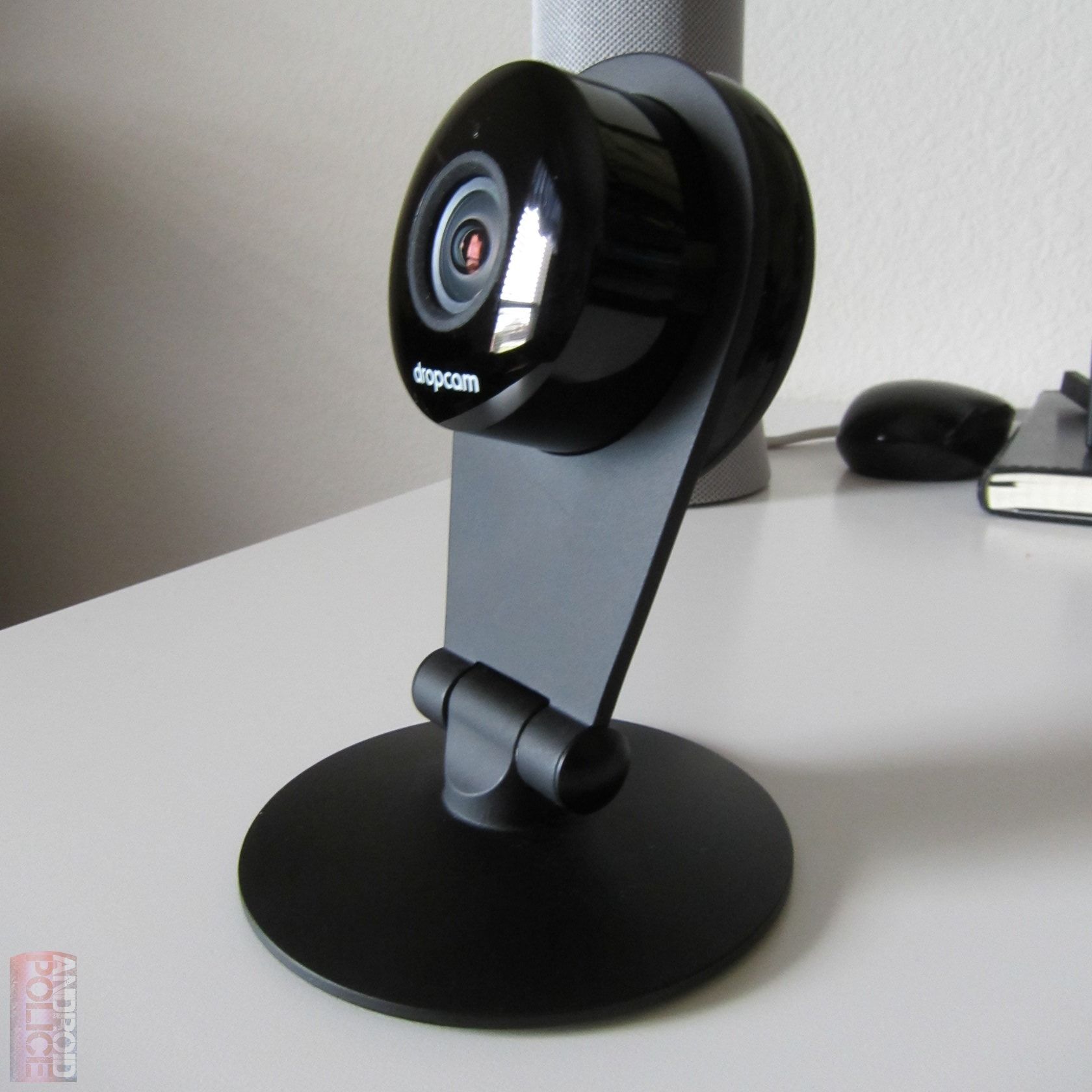 A Dropcam camera on a white desk