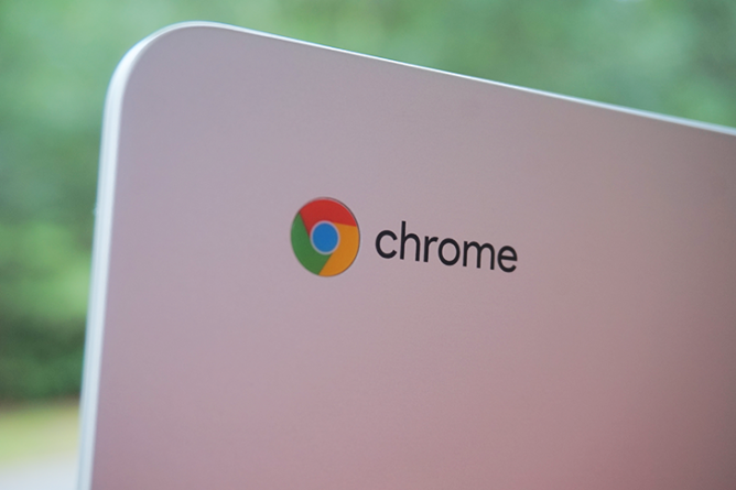 The corner of a Chromebook with the Google Chrome logo in the corner