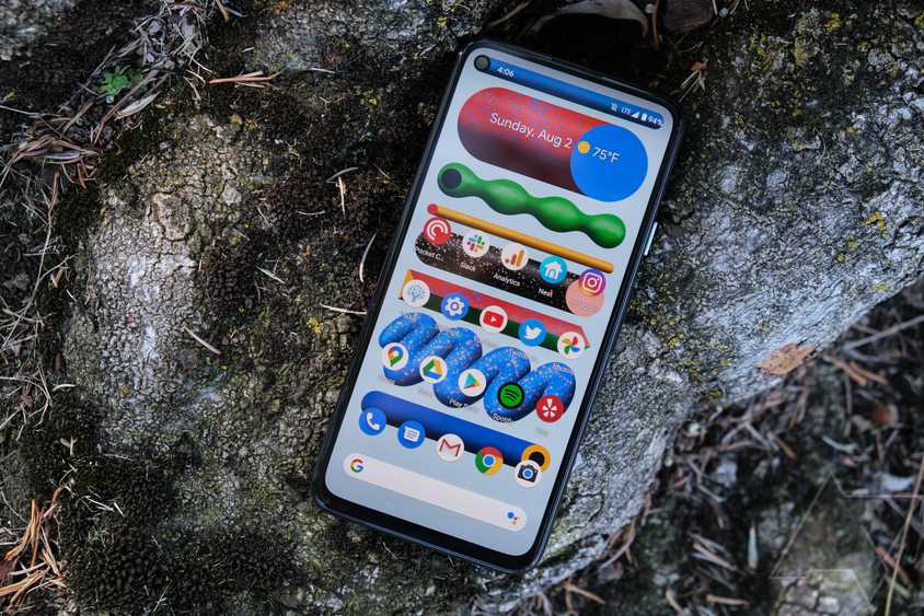 The Pixel 4a lying on a rock.