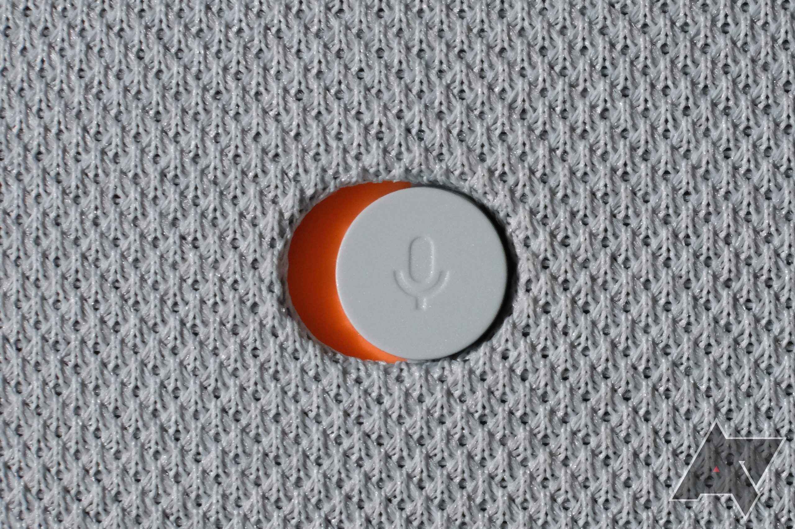 Close-up showing the mute switch on the Google Nest Audio speaker