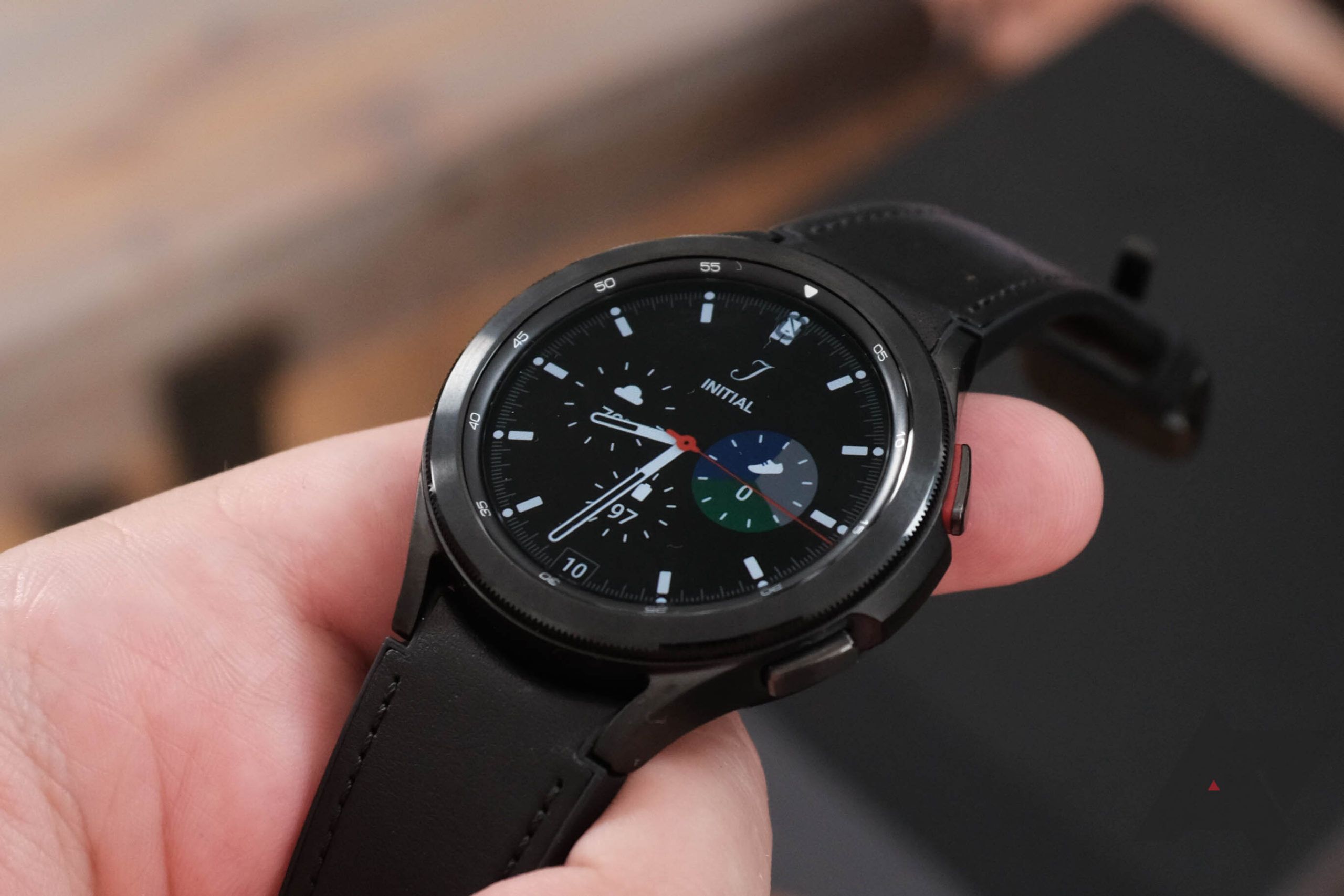 A Samsung Galaxy watch being held face up