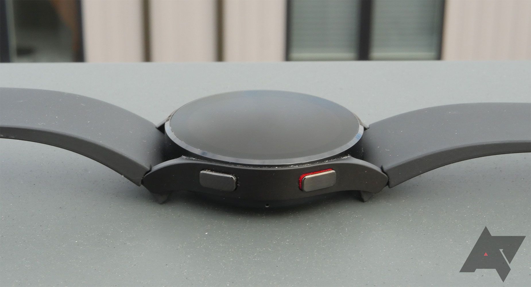 A smartwatch sitting on a table.