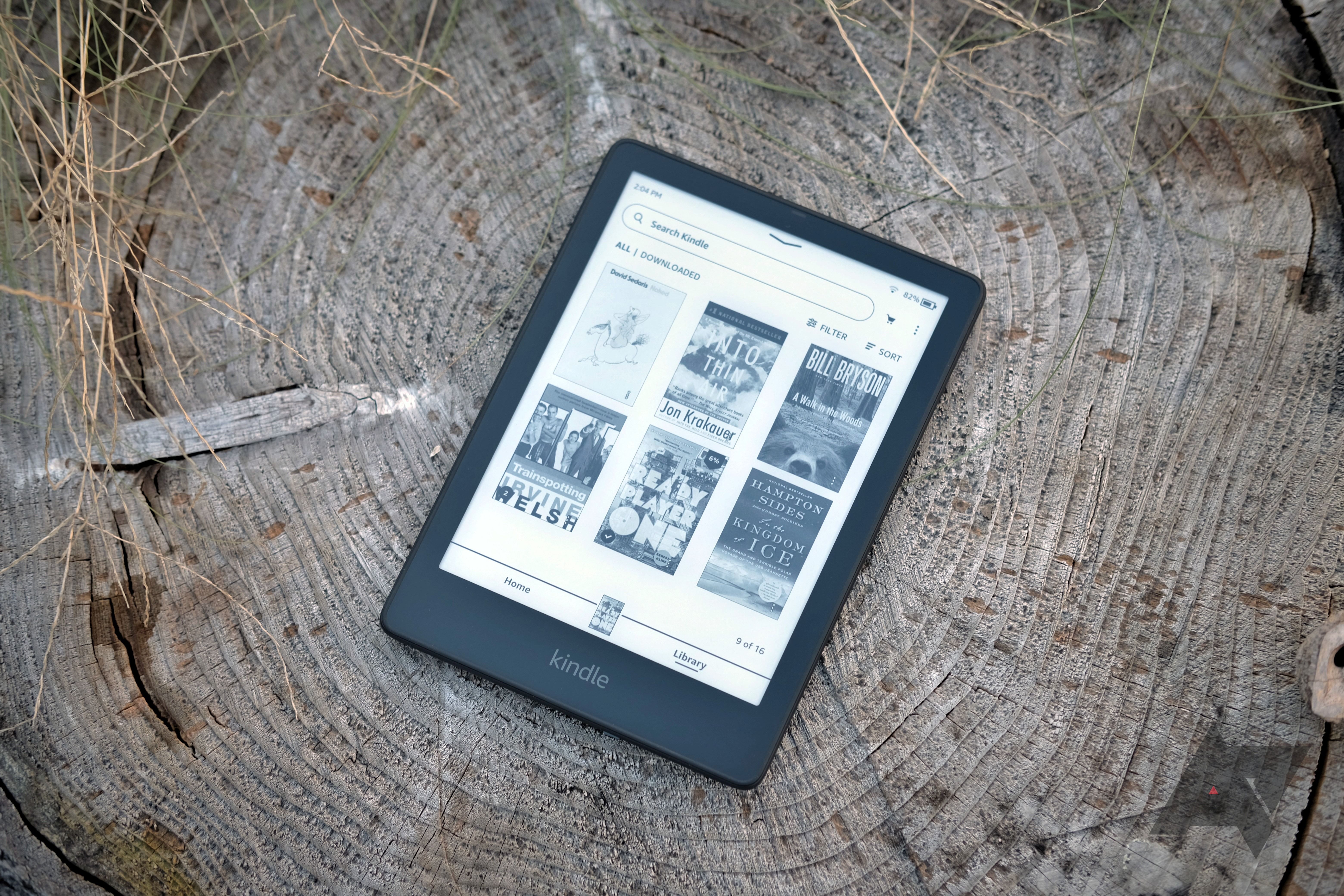 Kindle Paperwhite Signature Edition sitting on a wood surface