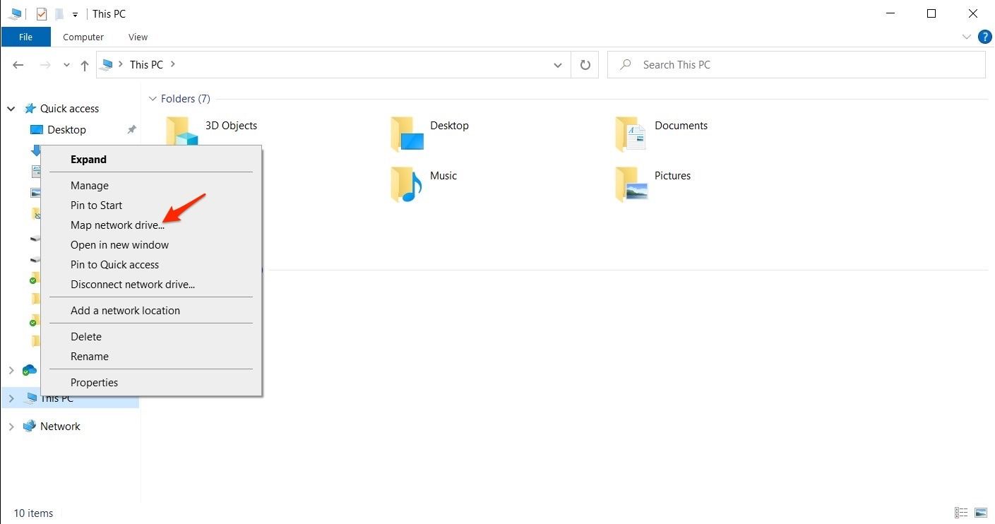 Screenshot shows Windows File Explorer with arrow pointing to 'Map network drive' in menu after right clicking 'This PC'.