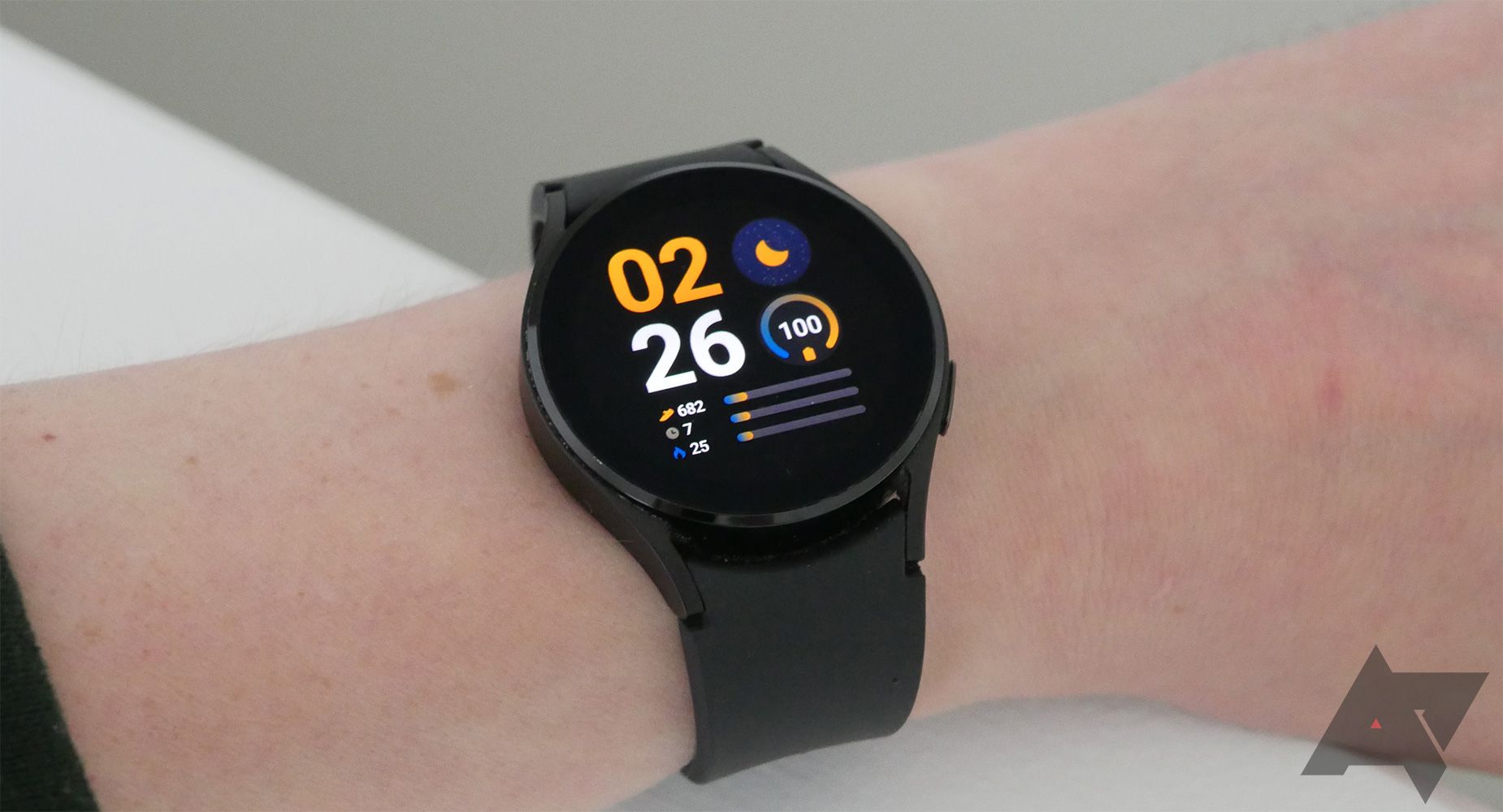 A smart watch with a colorful watch face.