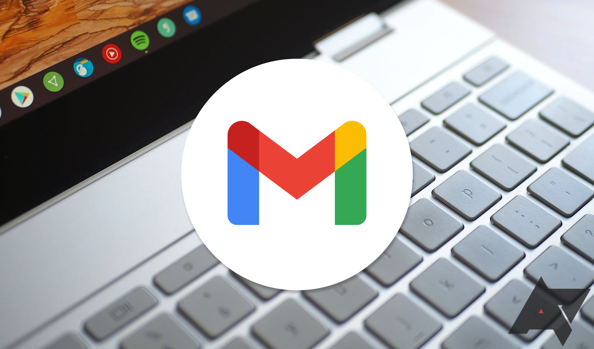 A Chromebook keyboard with a gmail logo overlaid