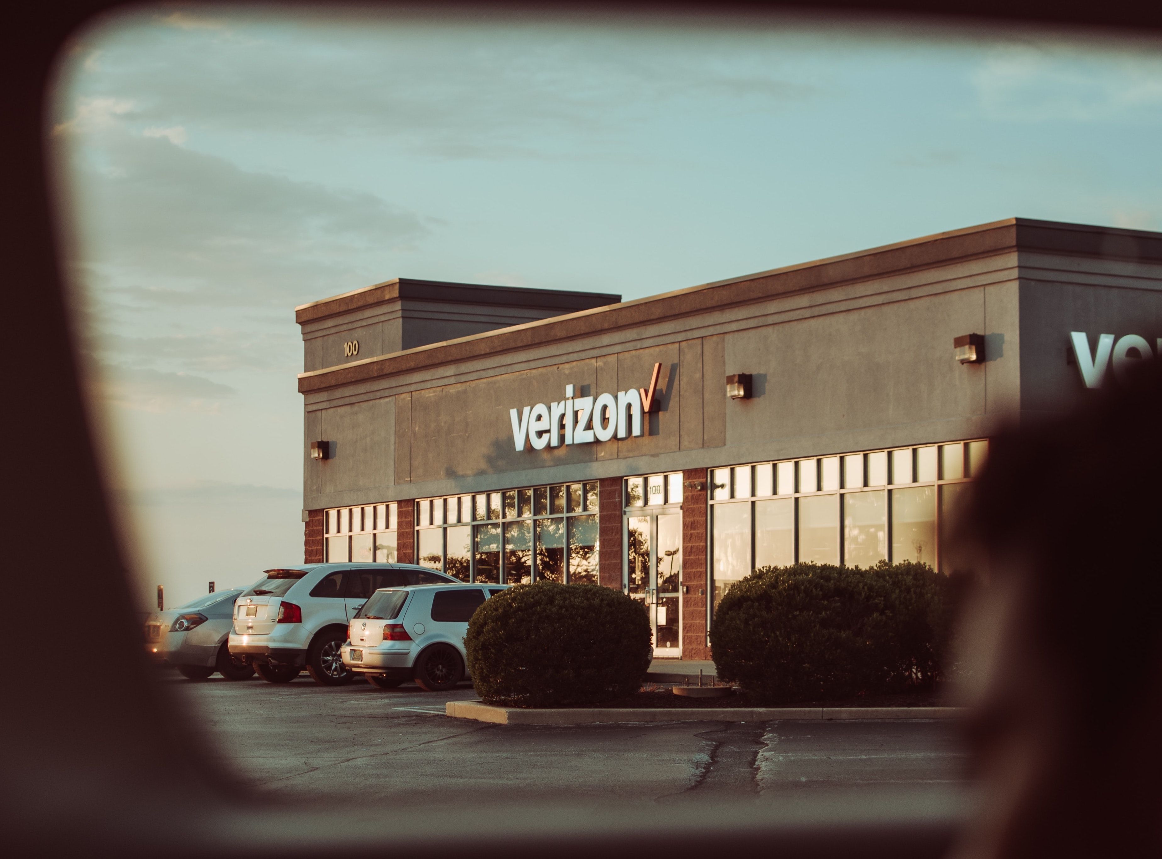 Veiew of a Verizon store at sunset.
