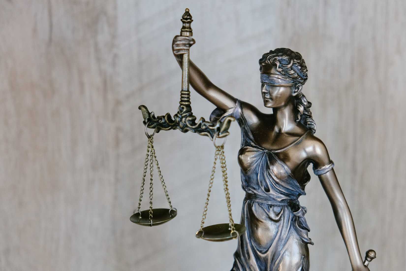 A statue of "Blind Justice" carrying a set of scales.
