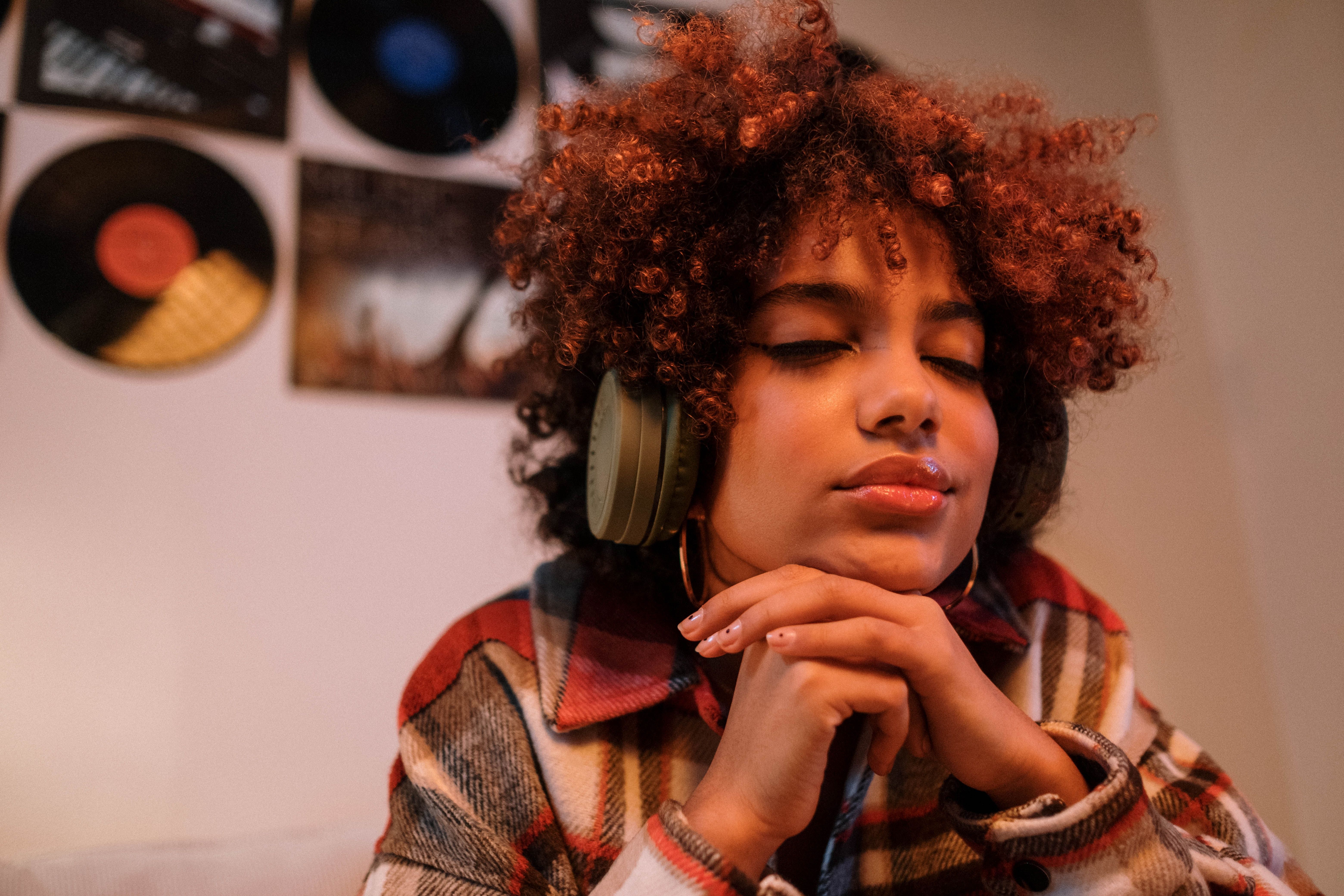 Photo of a woman listening to music on headphones