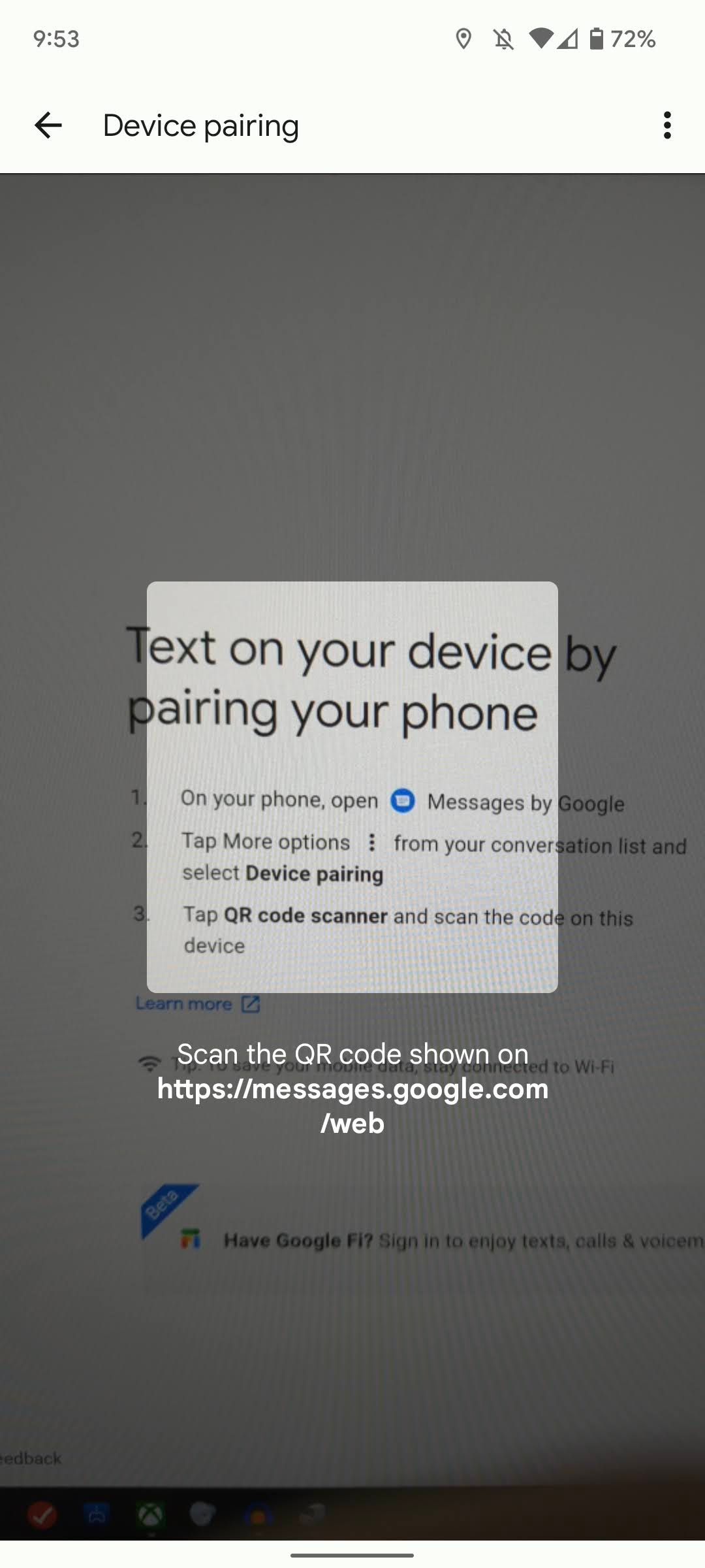 A photo scanning the QR code from the desktop interface on the web
