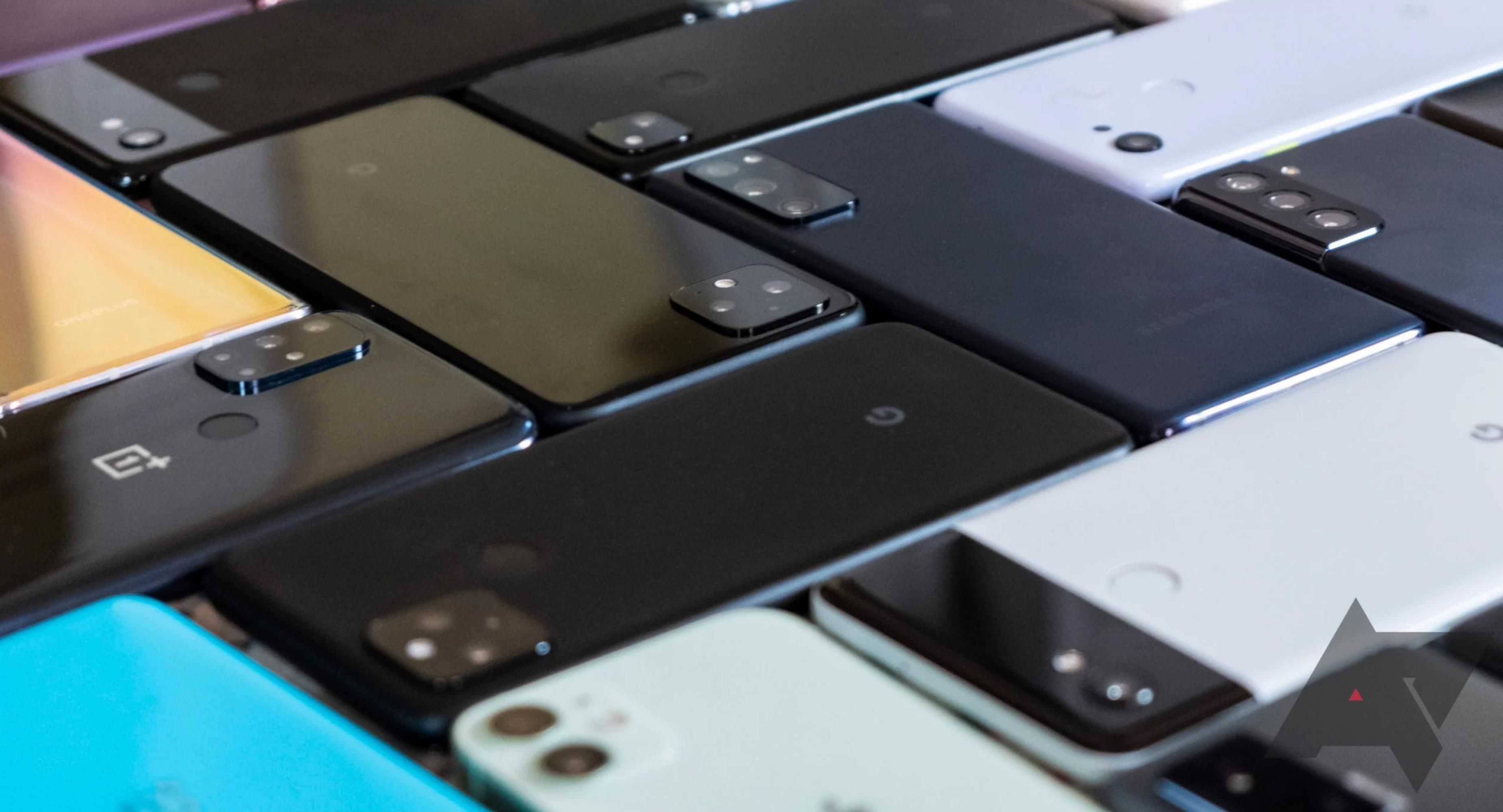 a wide variety of android phones laying face-down