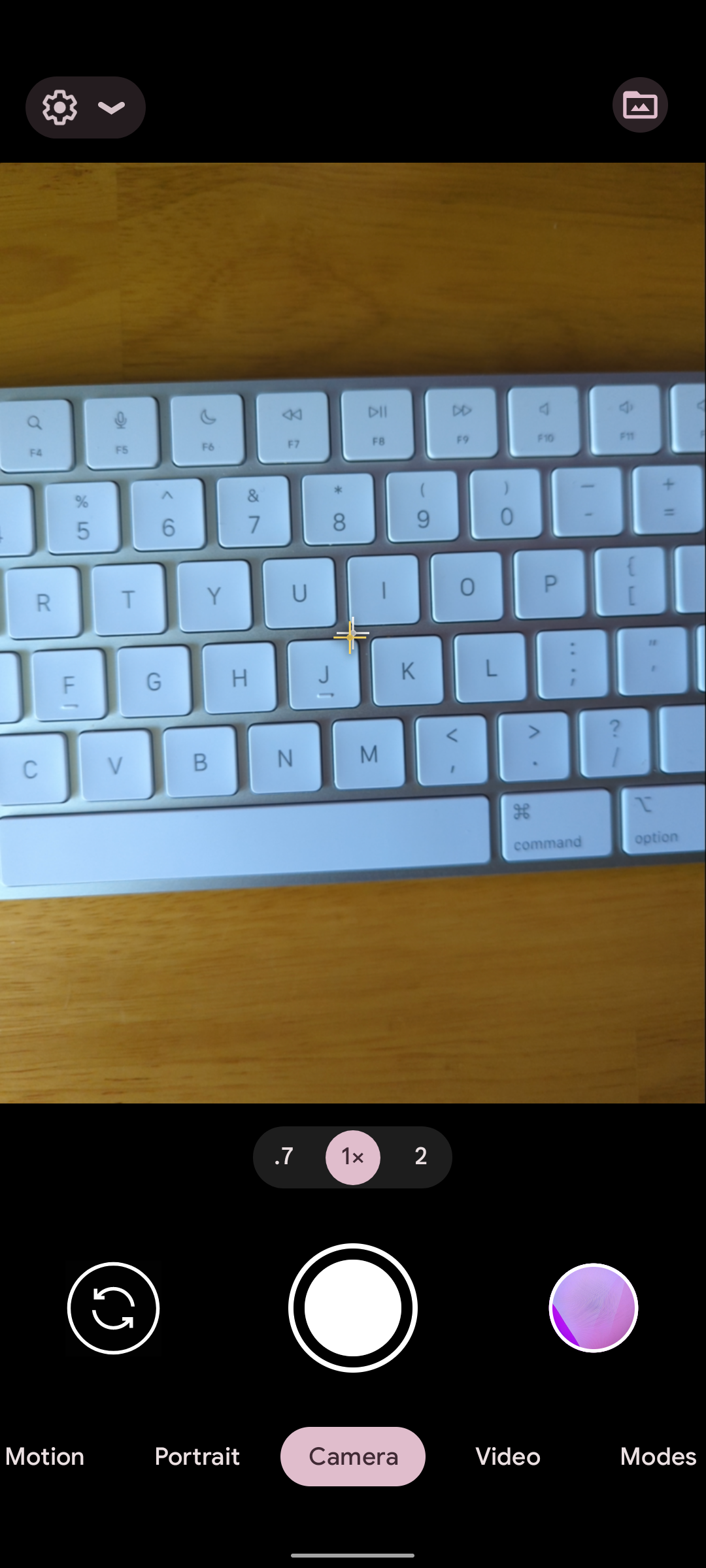 A screenshot of a keyboard visible in the Pixel camera's viewfinder.