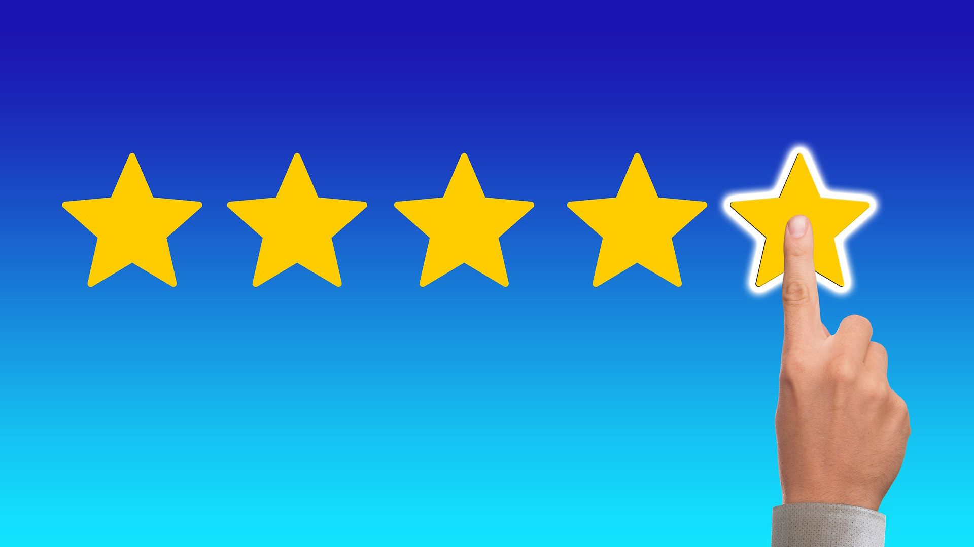 Five stars on a blue background with a man touching the illuminated fifth star. 