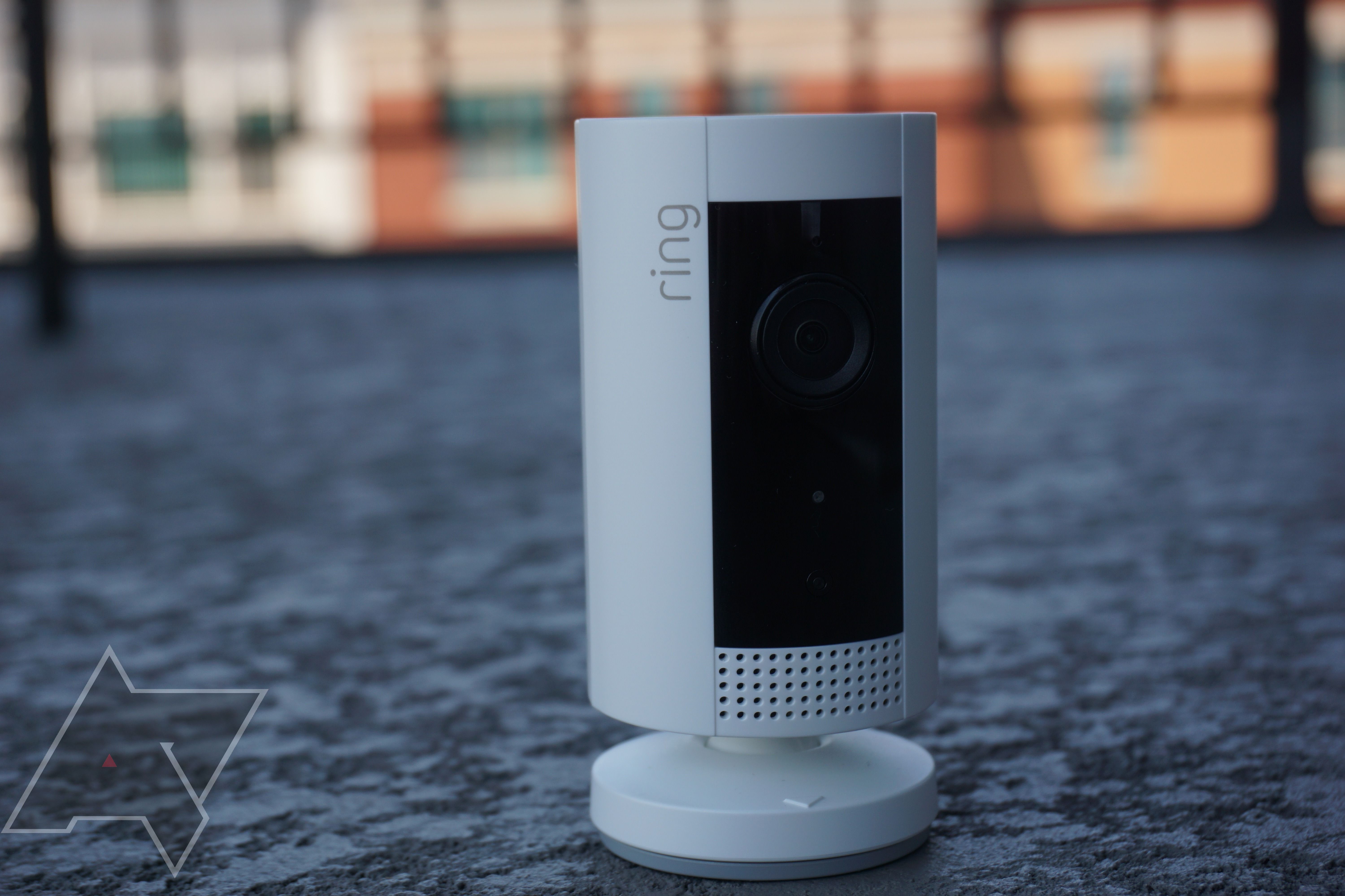 A Ring camera sitting on a tabletop.