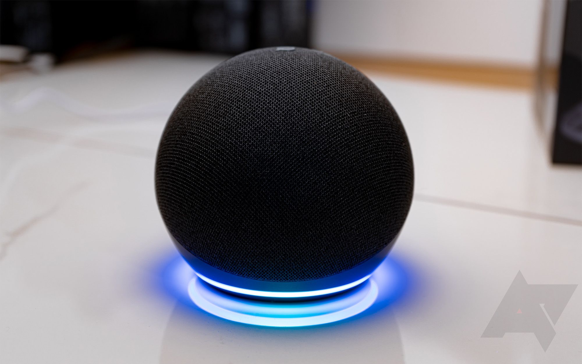 The Amazon Echo Dot 4th gen with the bottom ring lighted showing that the speaker is on