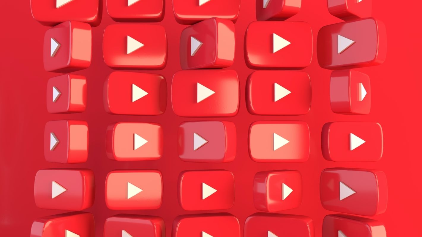 A wall of YouTube logos against a red background