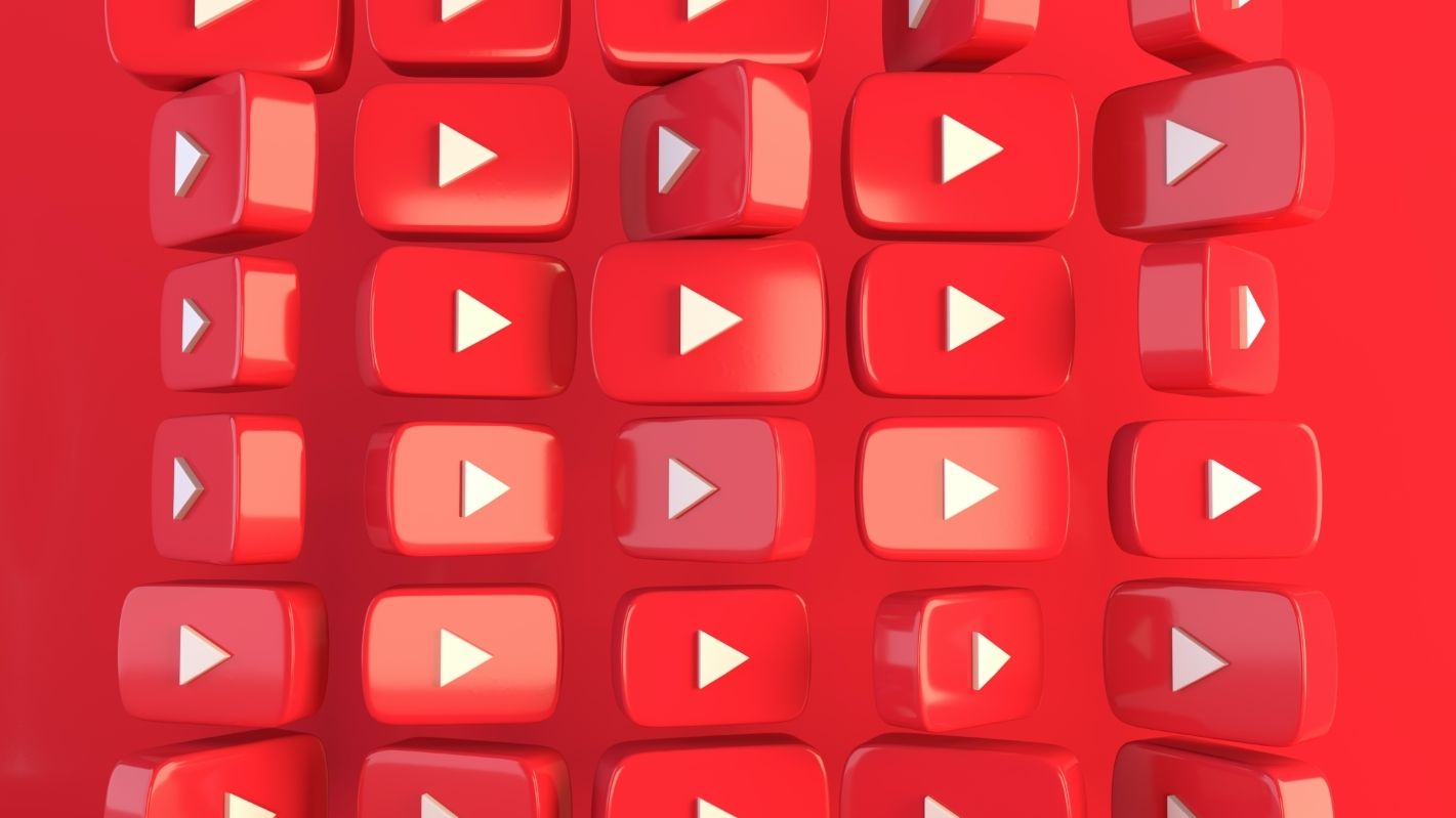 YouTube logo wall on red background