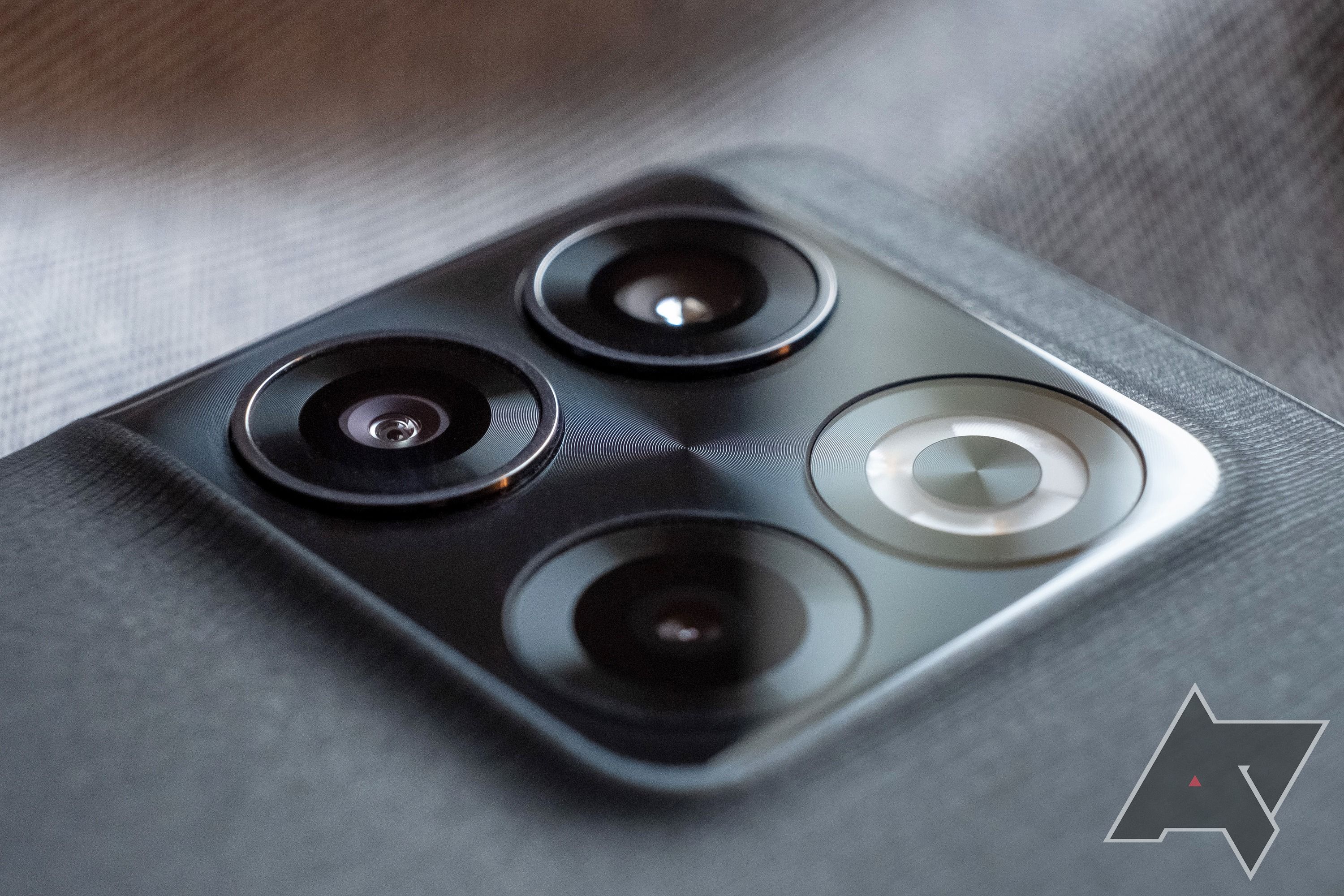 The rear camera array on a black OnePlus 10R.