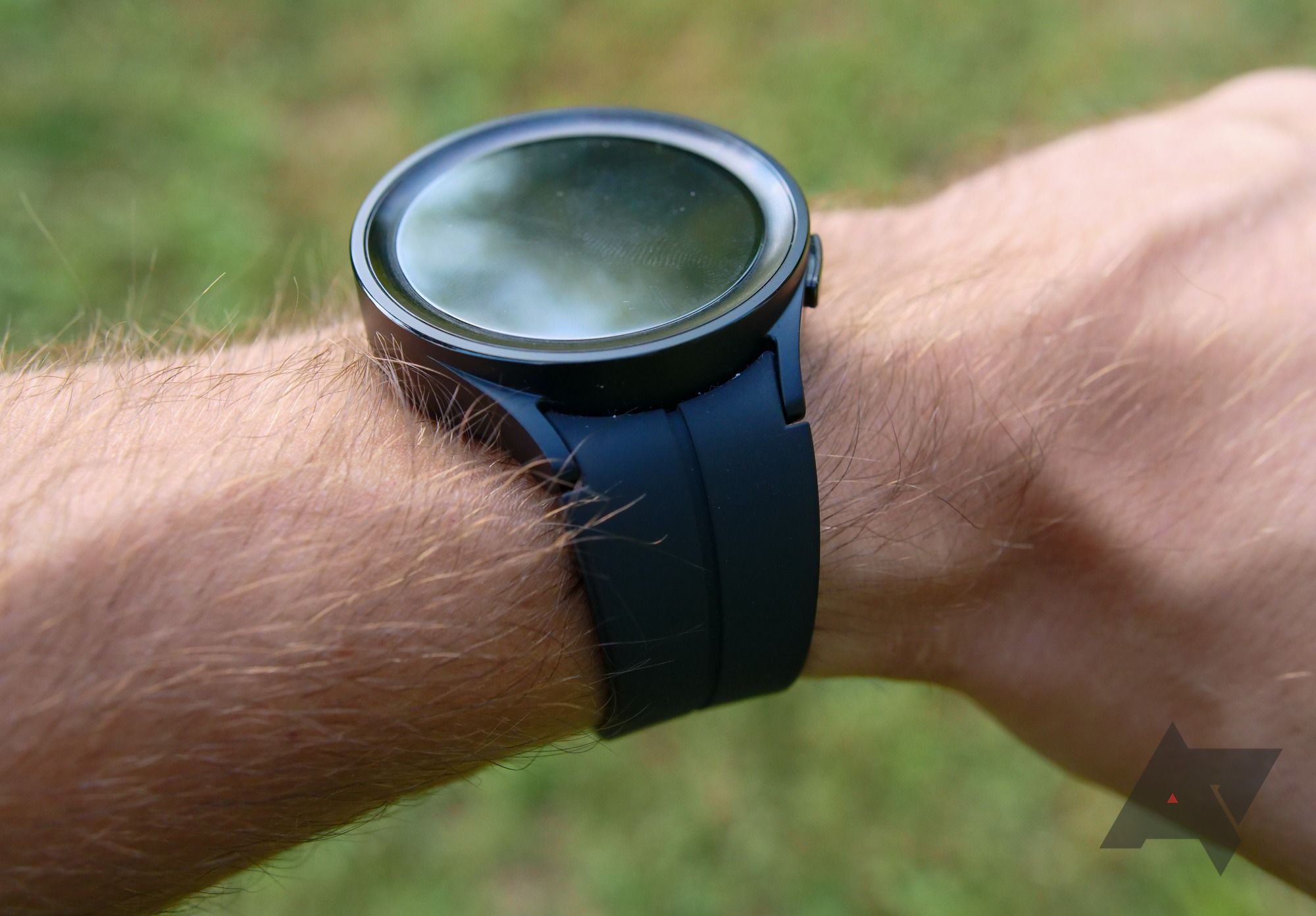 A large smartwatch on a person's wrist.