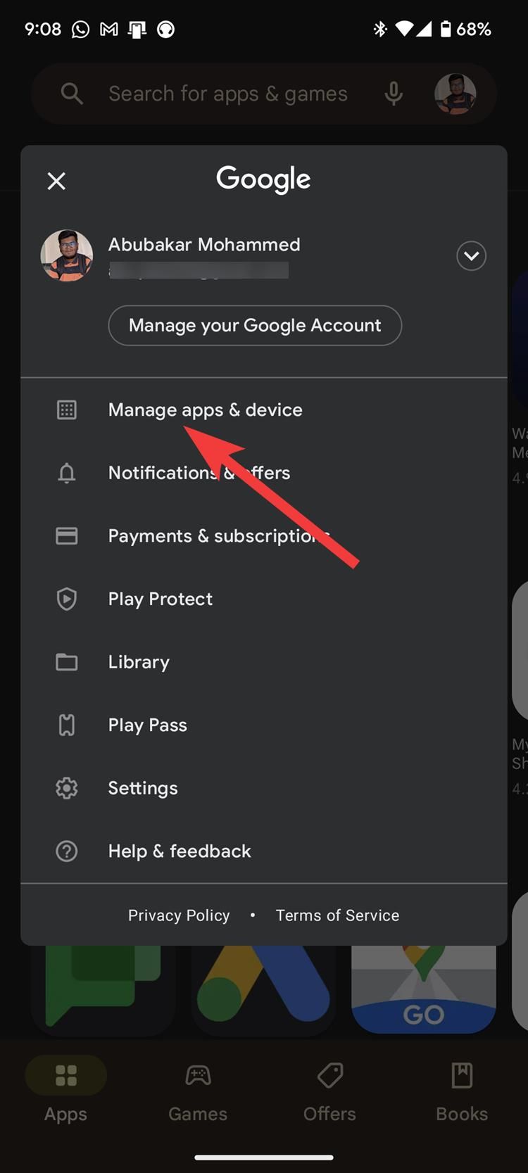 The Google Play Store profile menu with a red arrow pointing to the Manage apps & devices option