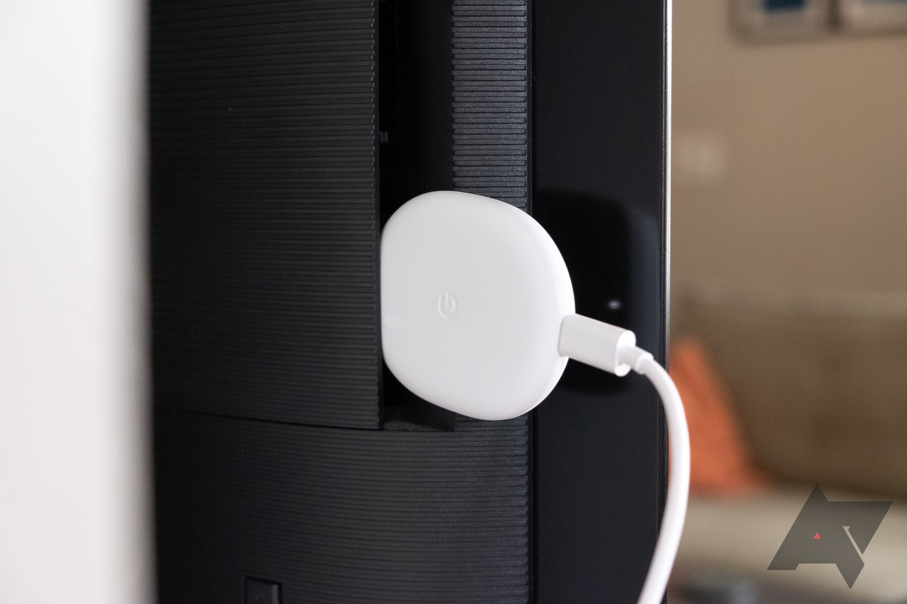 A Google Chromecast behind a Google TV