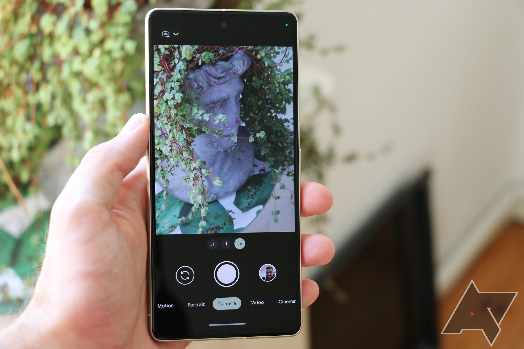The Google Pixel 7 handheld, with the camera app visible on the screen