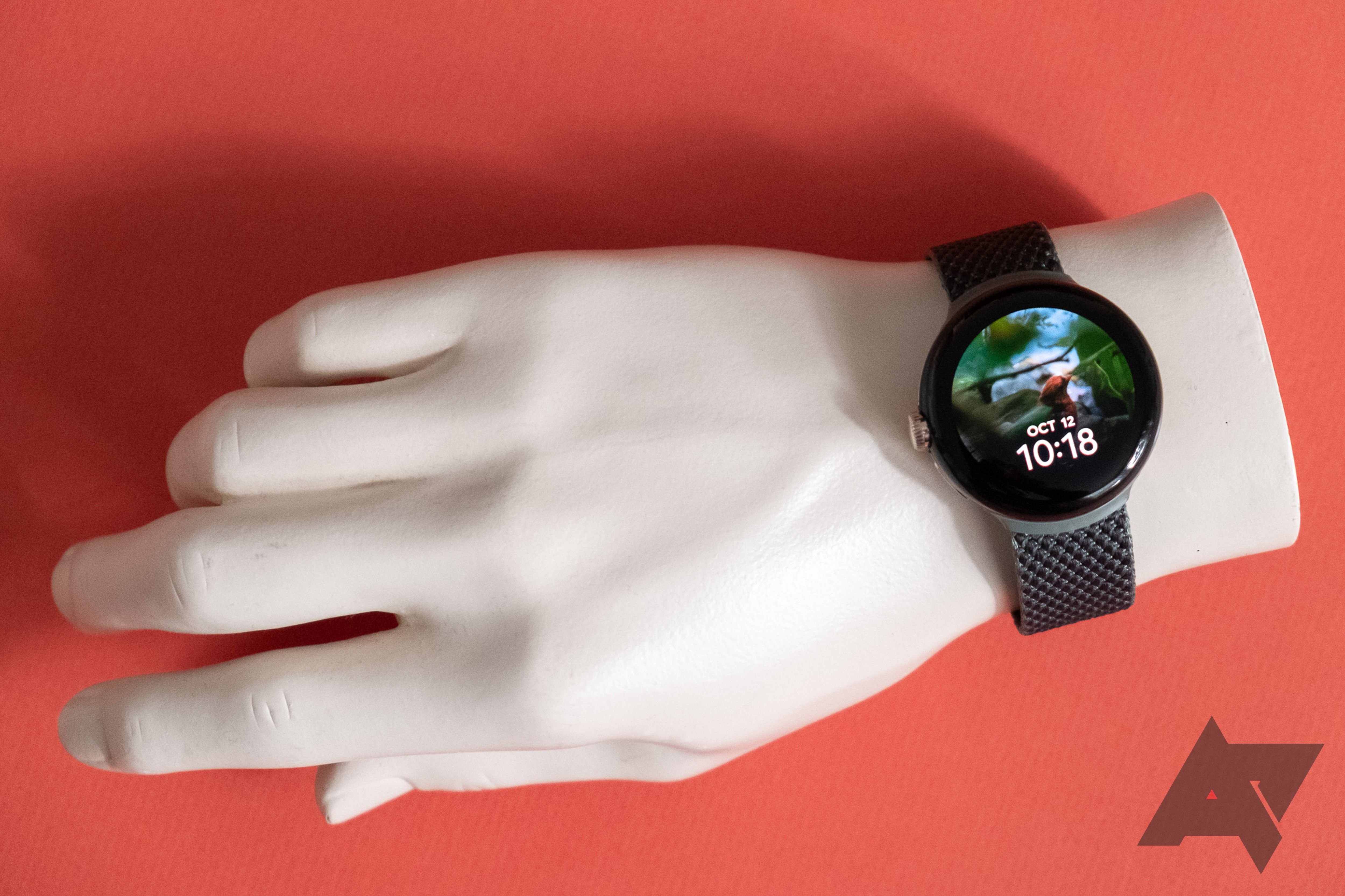 A plastic hand wearing a smartwatch.