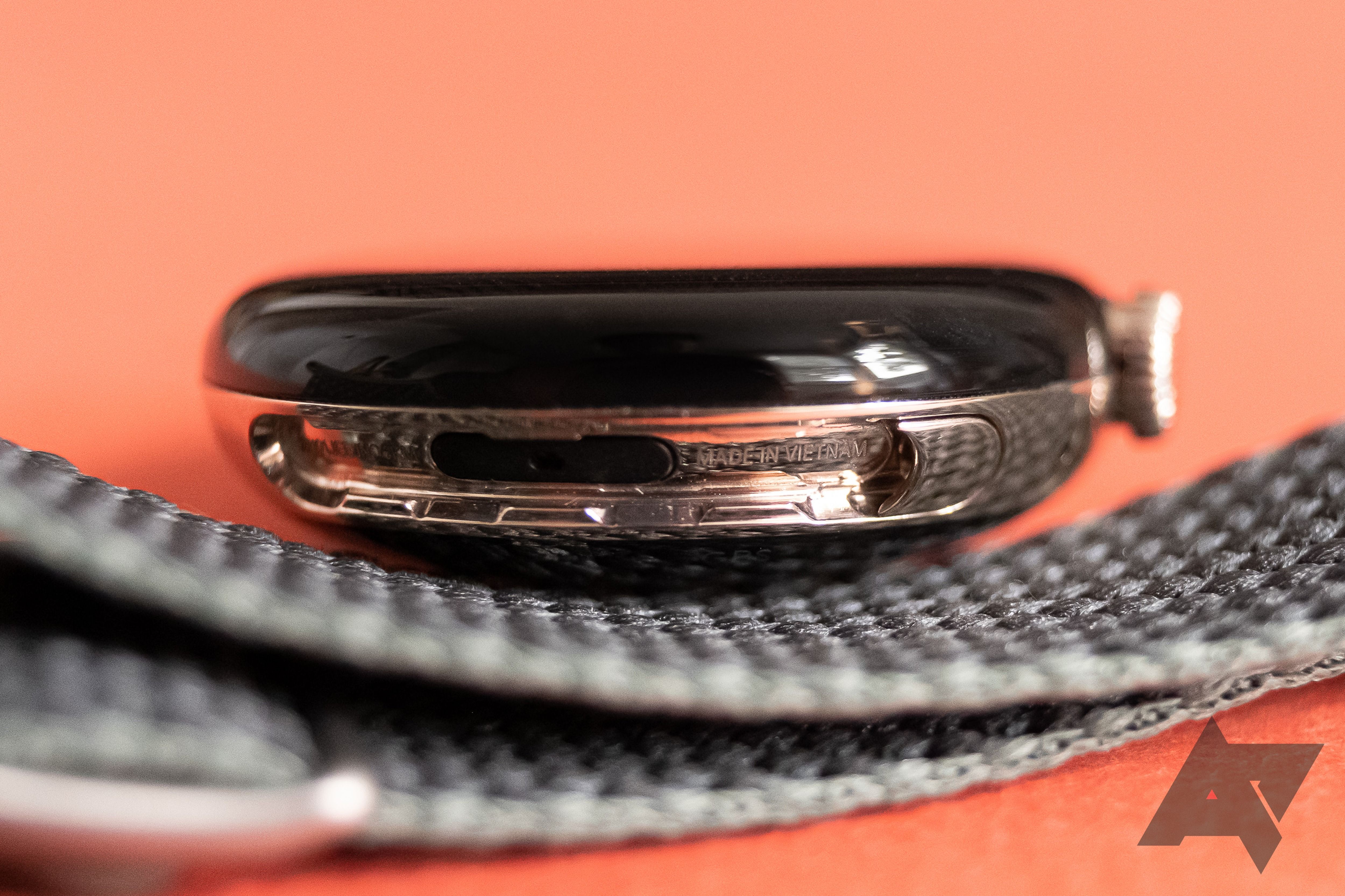 A detail photo of a smartwatch's band mechanism.