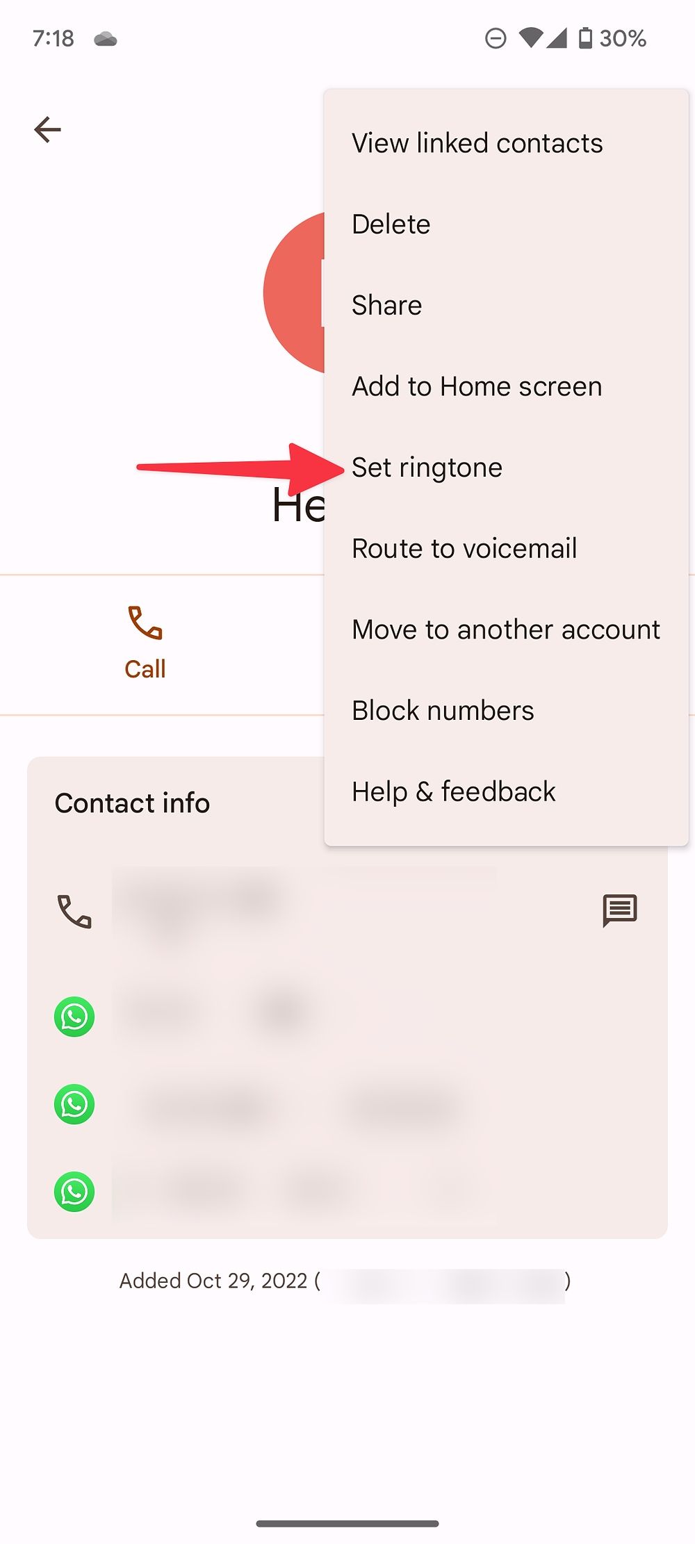 Screenshot shows the triple-dot menu drop down for a specific contact on android. An arrow points to the 'Set ringtone' option.
