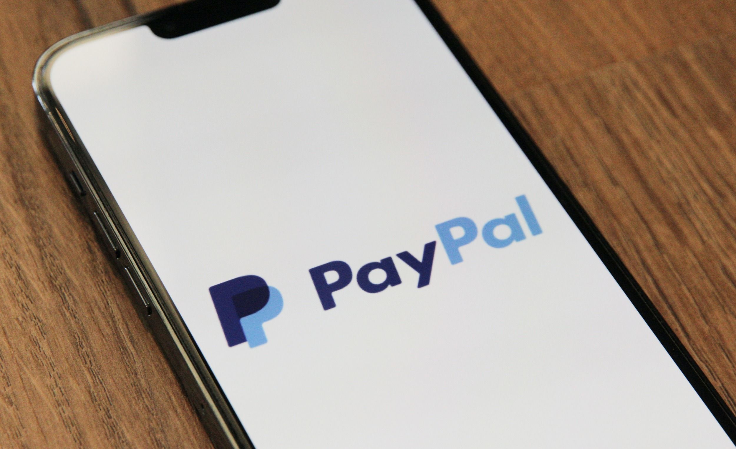 The PayPal logo on a phone screen