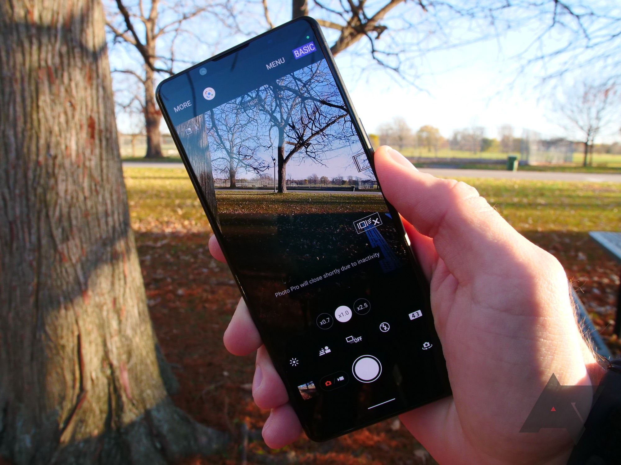 Sony's phone held up with the camera UI shown.