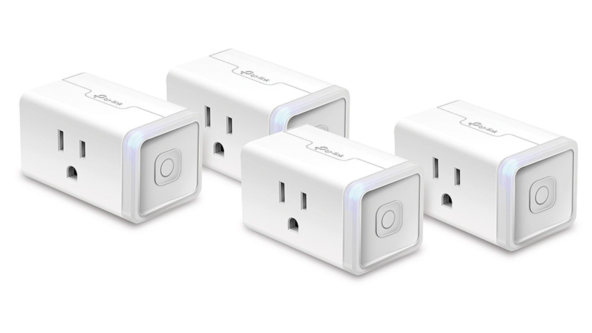 four white tp-link smart plugs on white background