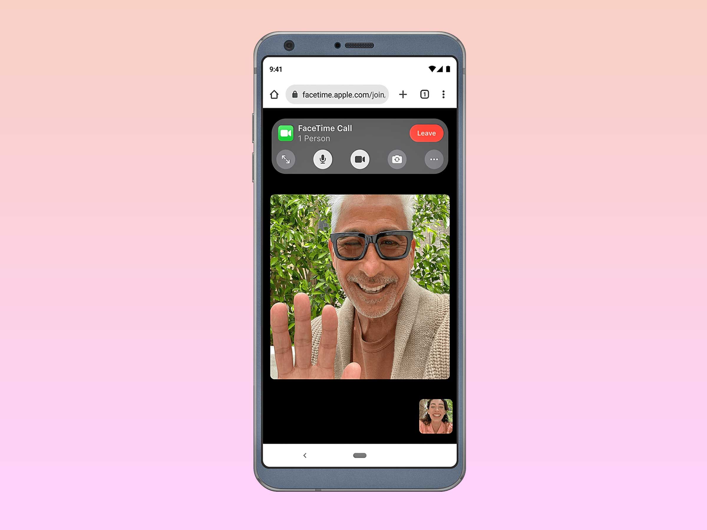 An Android phone showing a man waving during a FaceTime call.