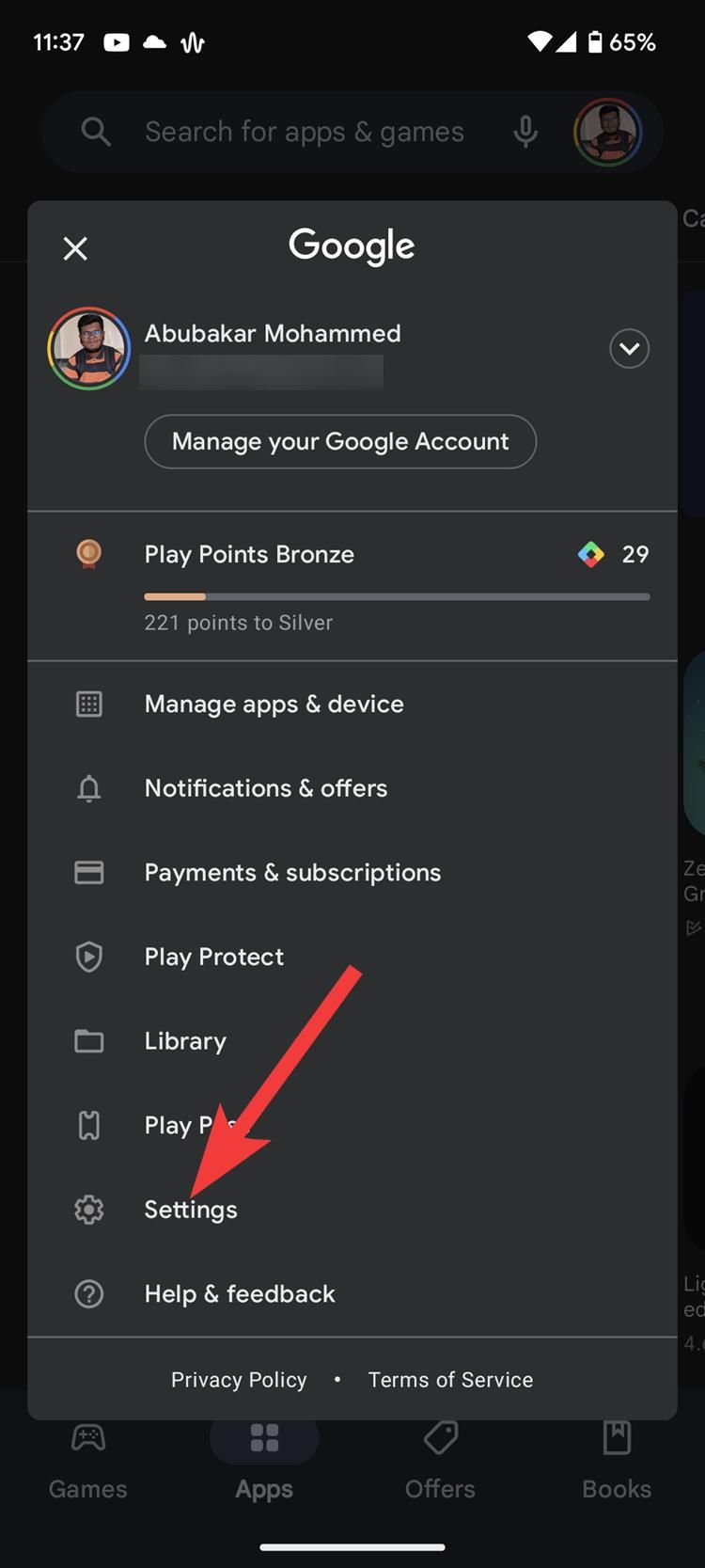 The Google Play Store icon menu with a red arrow pointing to the Settings option