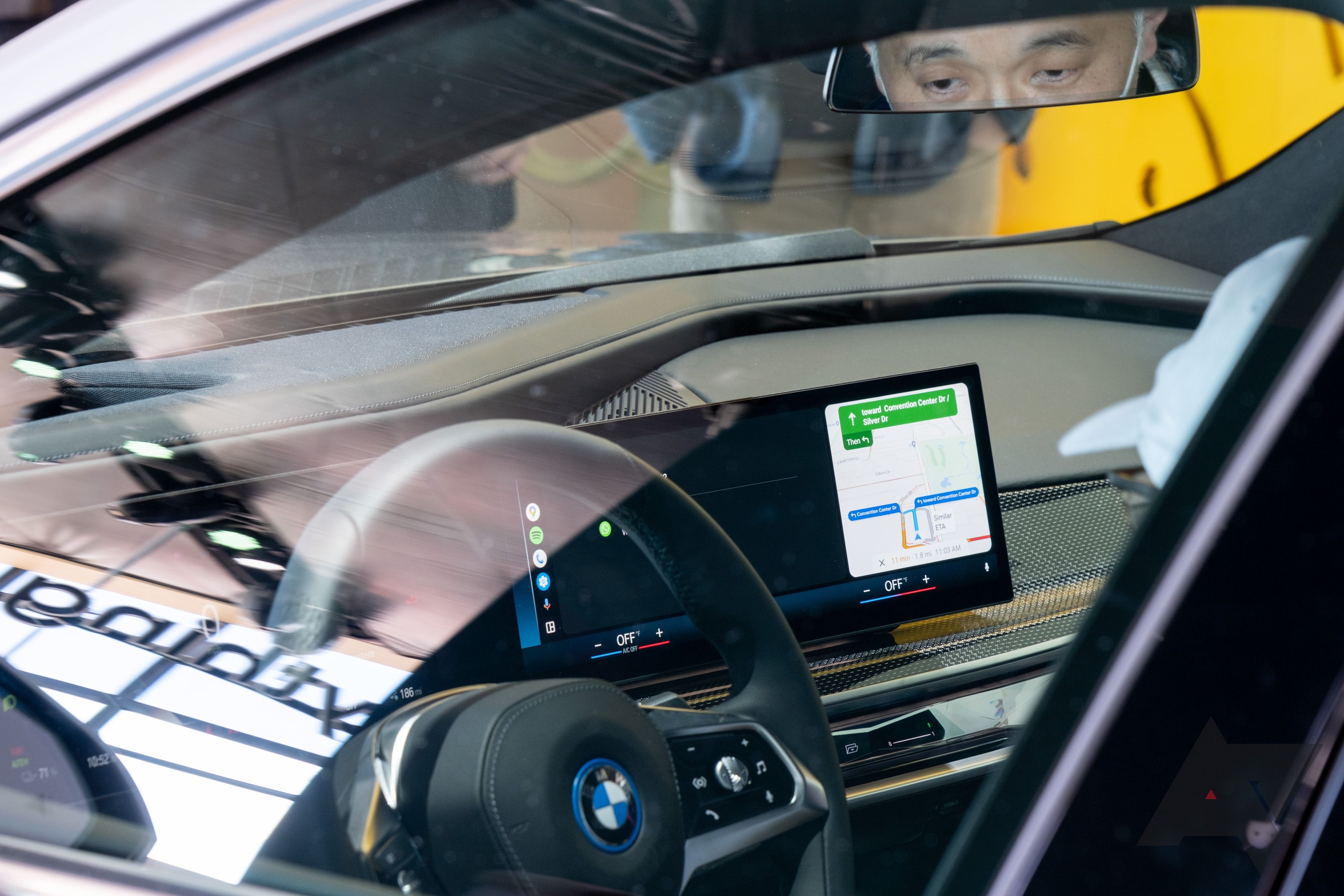 A car dashboard showing Android Auto on the screen