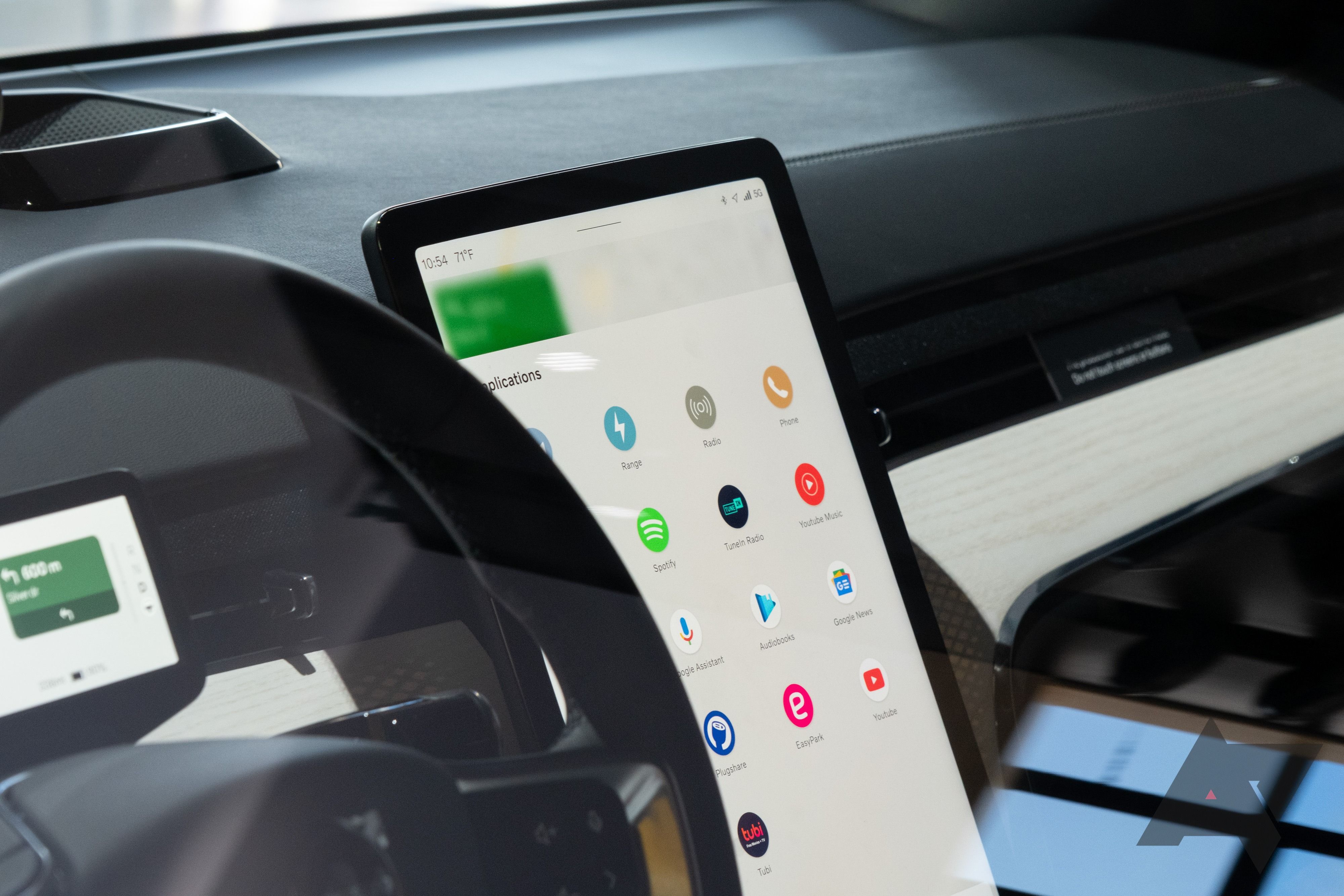 A car infotainment screen showing Android Auto's app drawer.