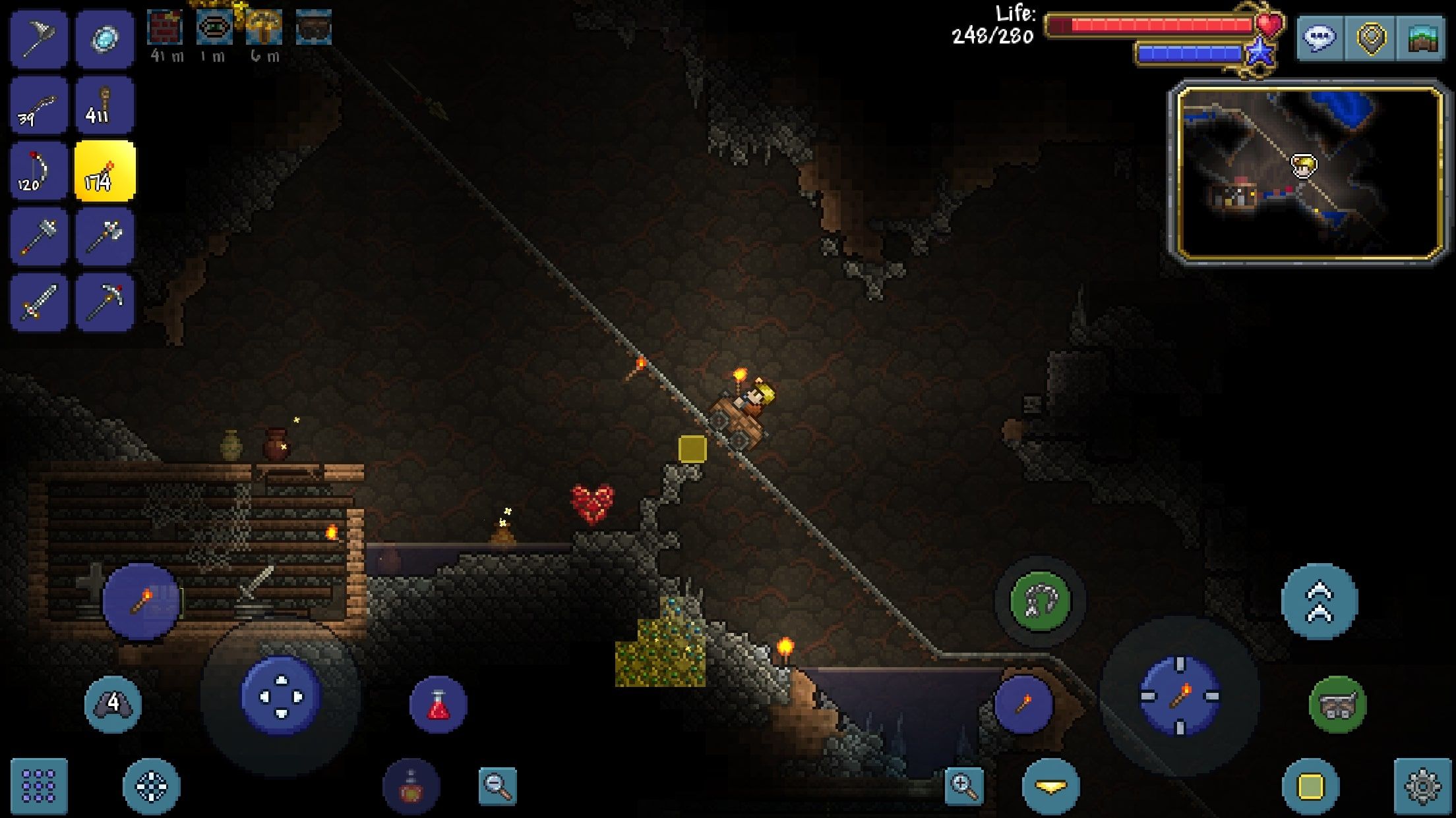 Terraria showing a character driving in a mine cart in a dark dungeon