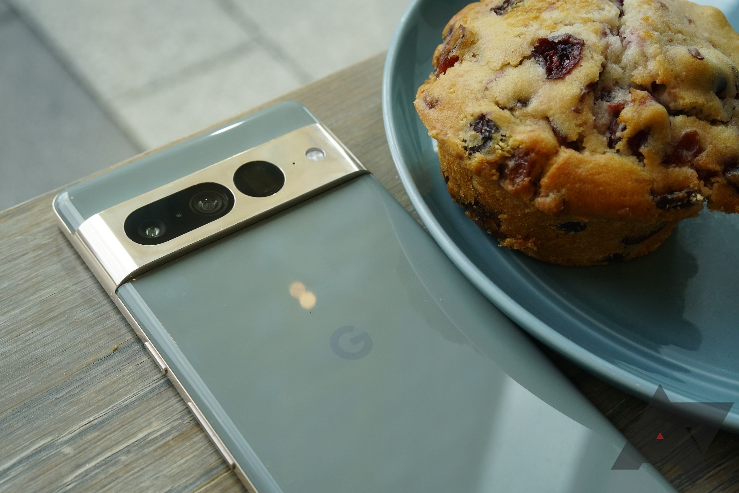 The Pixel 7 Pro sitting next to a muffin