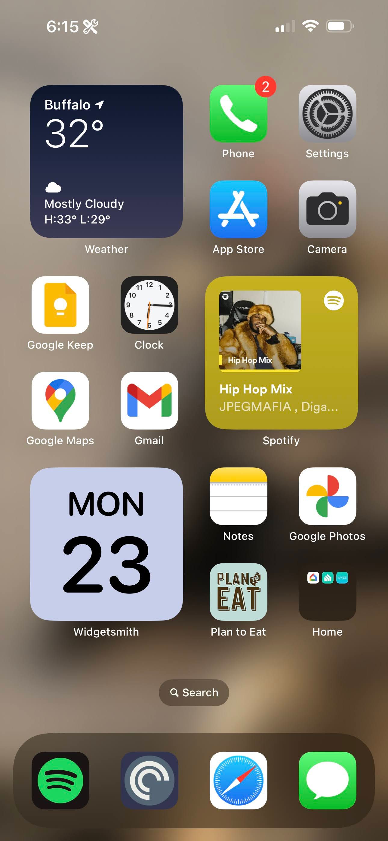 A screenshot of the iOS home screen, with several apps and widgets along the page.