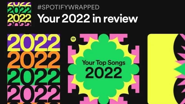 Screenshot of the Spotify Wrapped vital banner featuring a hashtag reading ‘#SpotifyWrapped’, a headline announcing ‘Your 2022 in Review’, and colourful graphics.