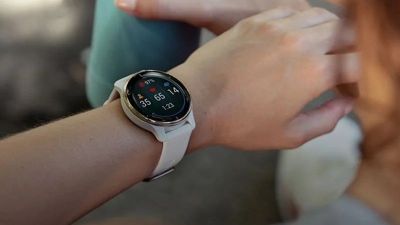 A Garmin Venu 2 Plus smartwatch on the wrist.