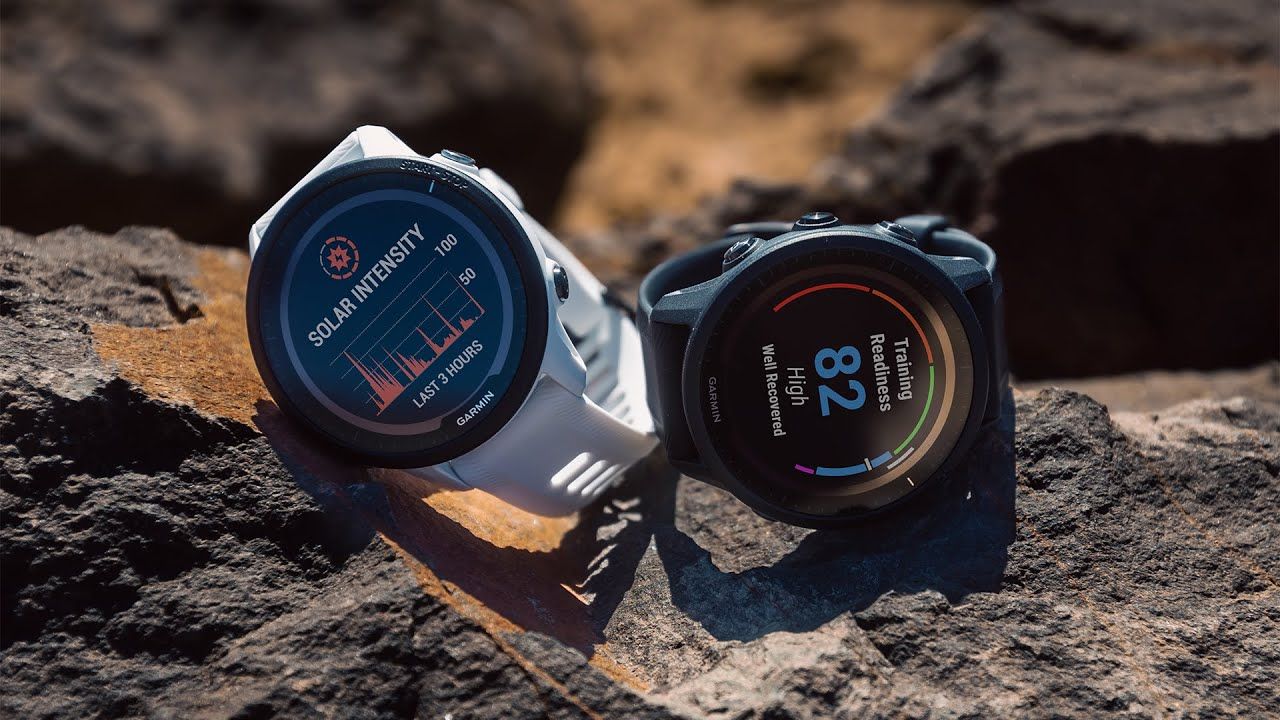 The Garmin Forerunner 955 and 955 Solar placed sat on some rocks