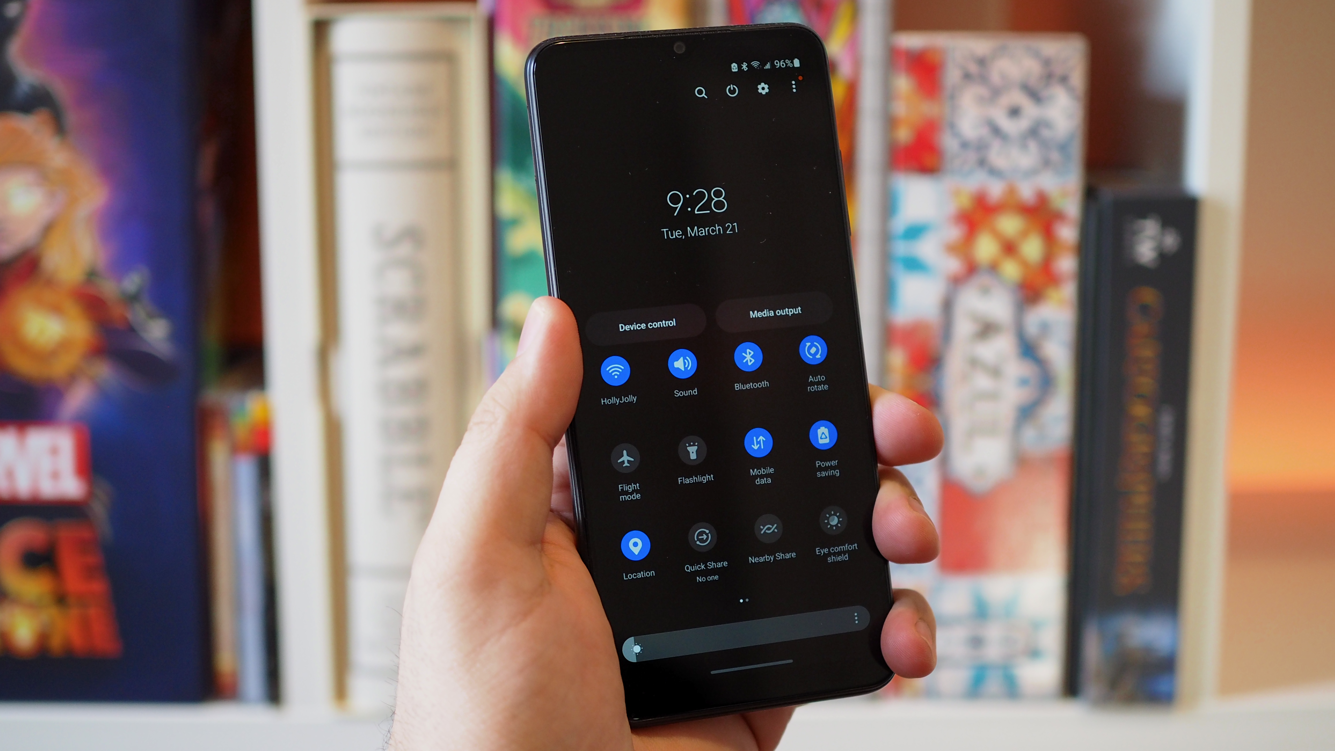Samsung Galaxy A03s in hand on pull down menu