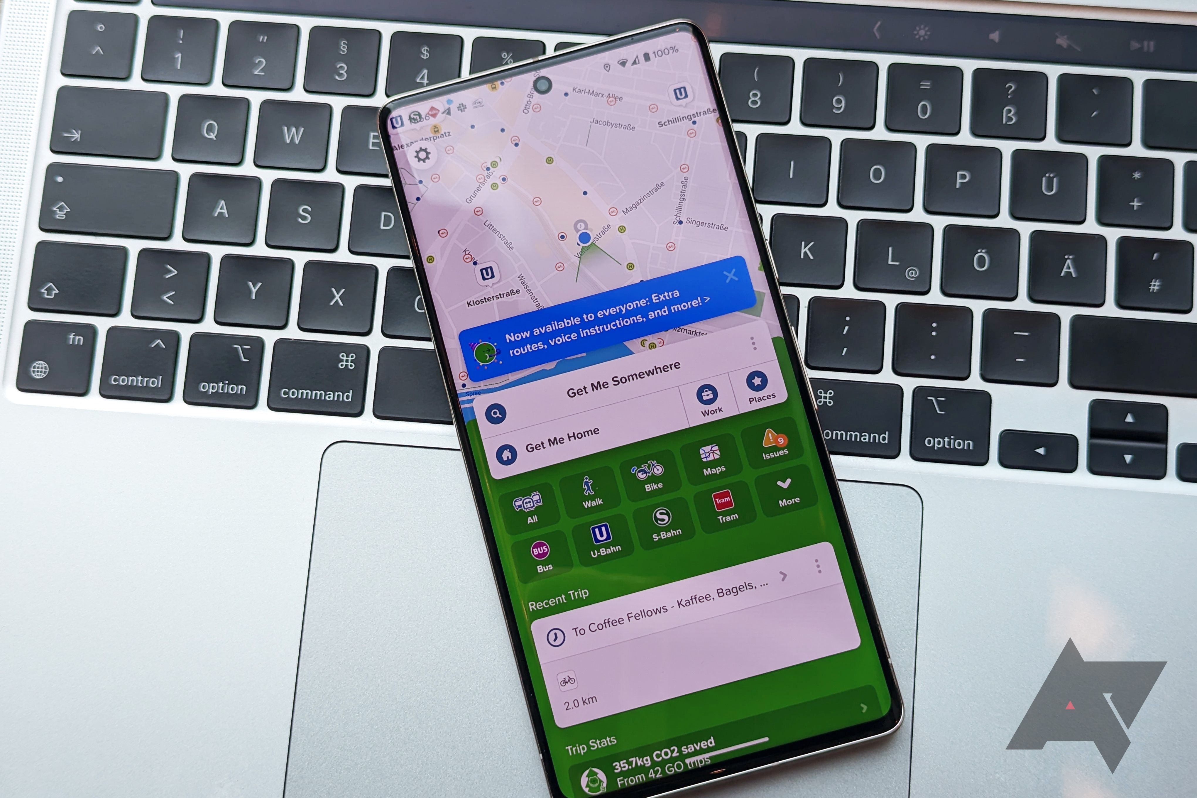 A Google Pixel 7 Pro on the keyboard of a MacBook Pro with the Citymapper app's home screen opened