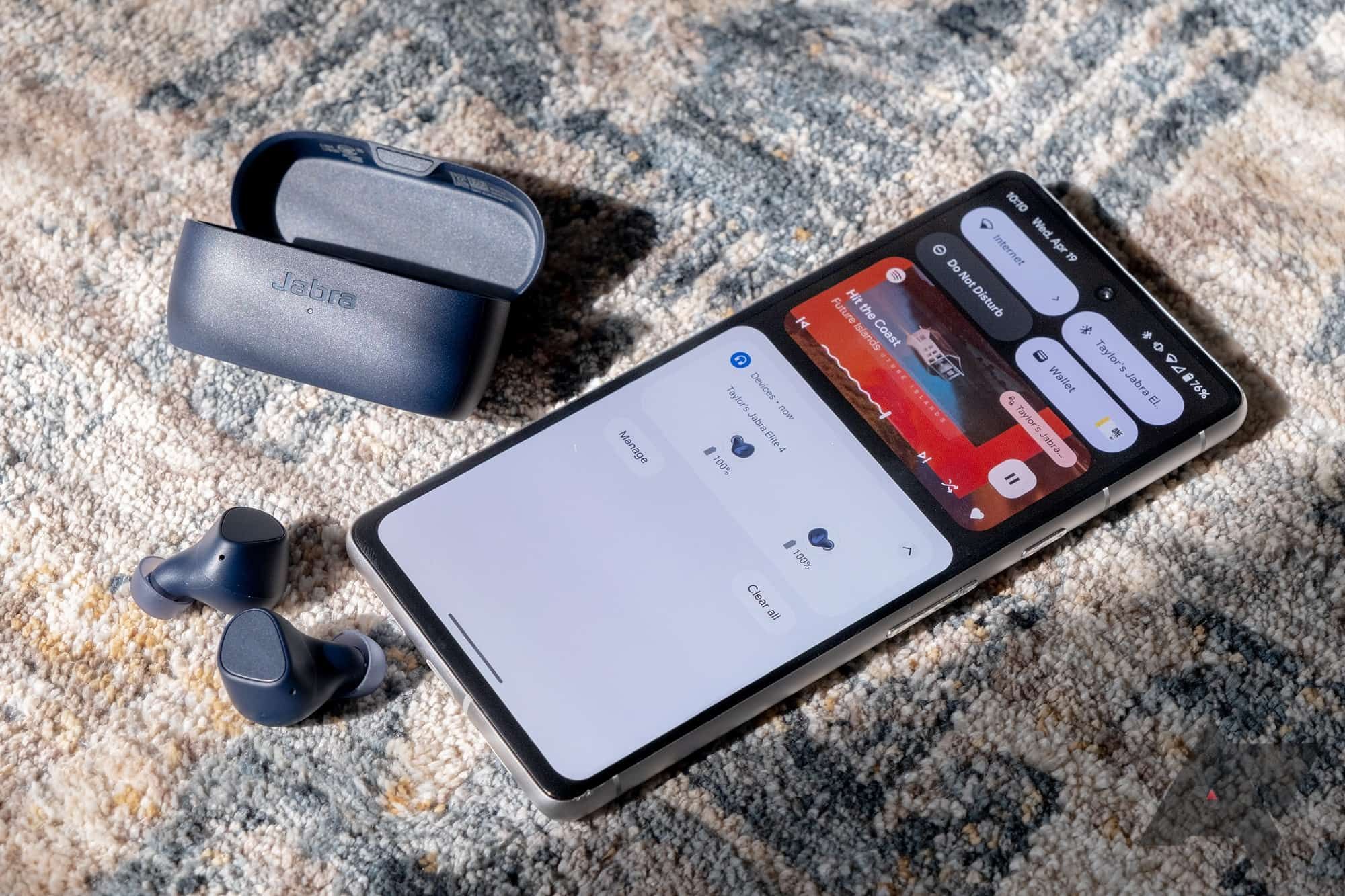 A pair of Jabra earbuds that has been paired with a smartphone