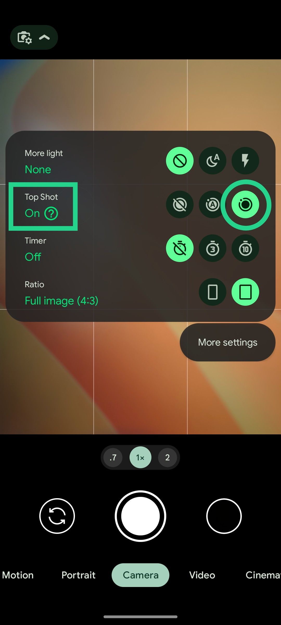 A Pixel phone's camera viewfinder with Top Shot settings highlighted.