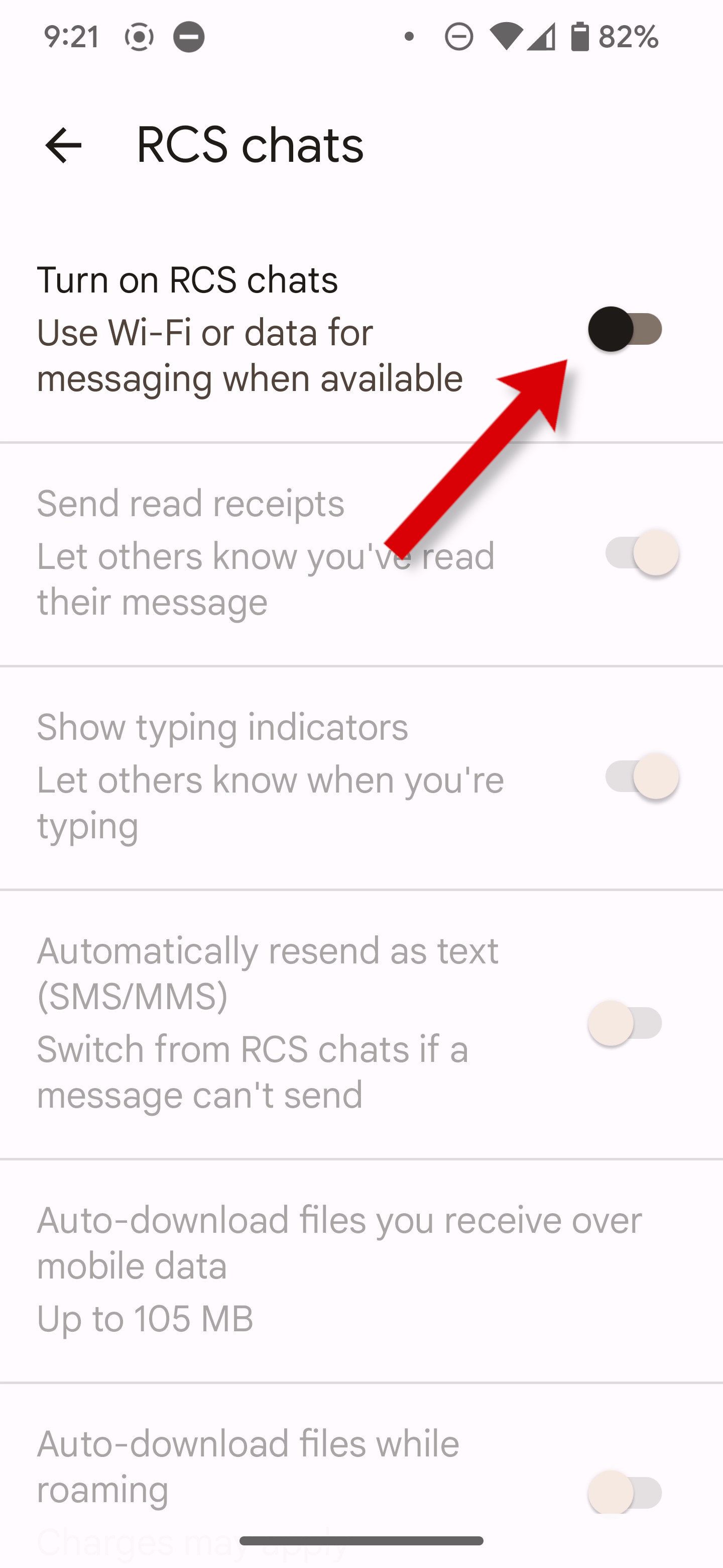 A screenshot of Google Messages settings with an arrow pointing to the RCS chats toggle switch.