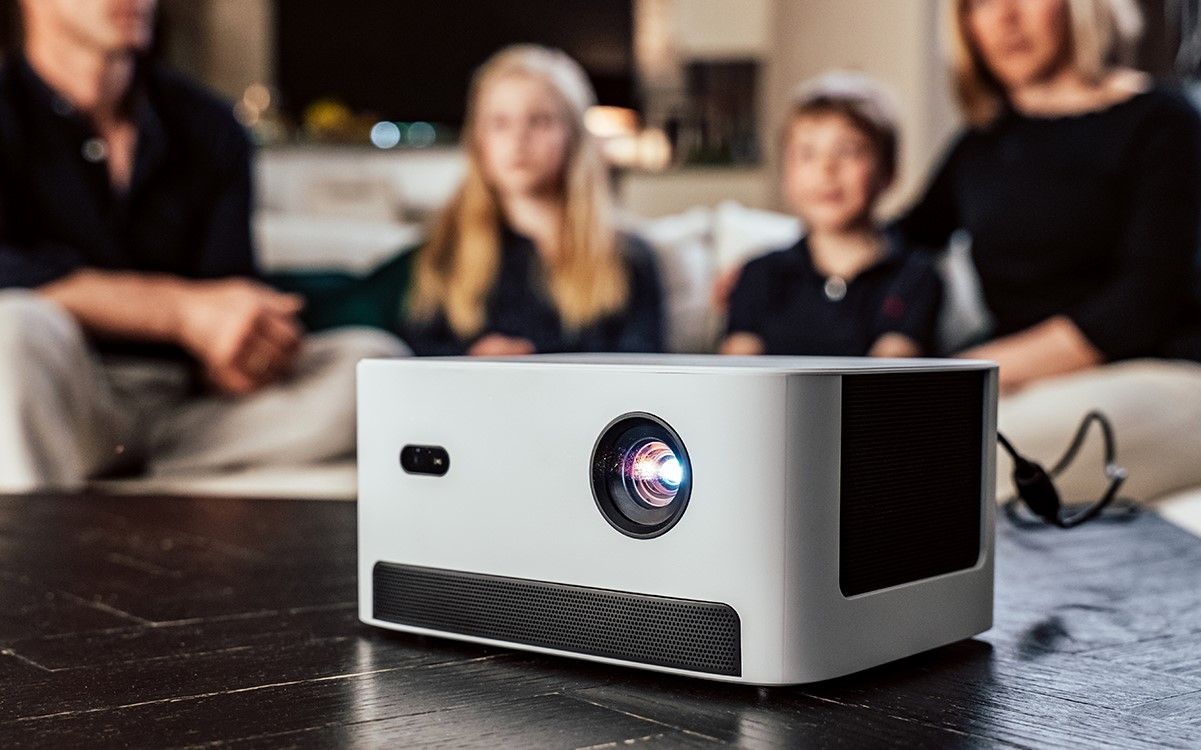 A family watching movies with Dangbei Neo projector