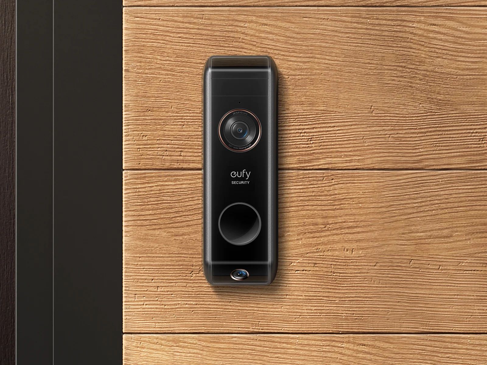 Eufy's dual-camera video doorbell mounted outside of a house