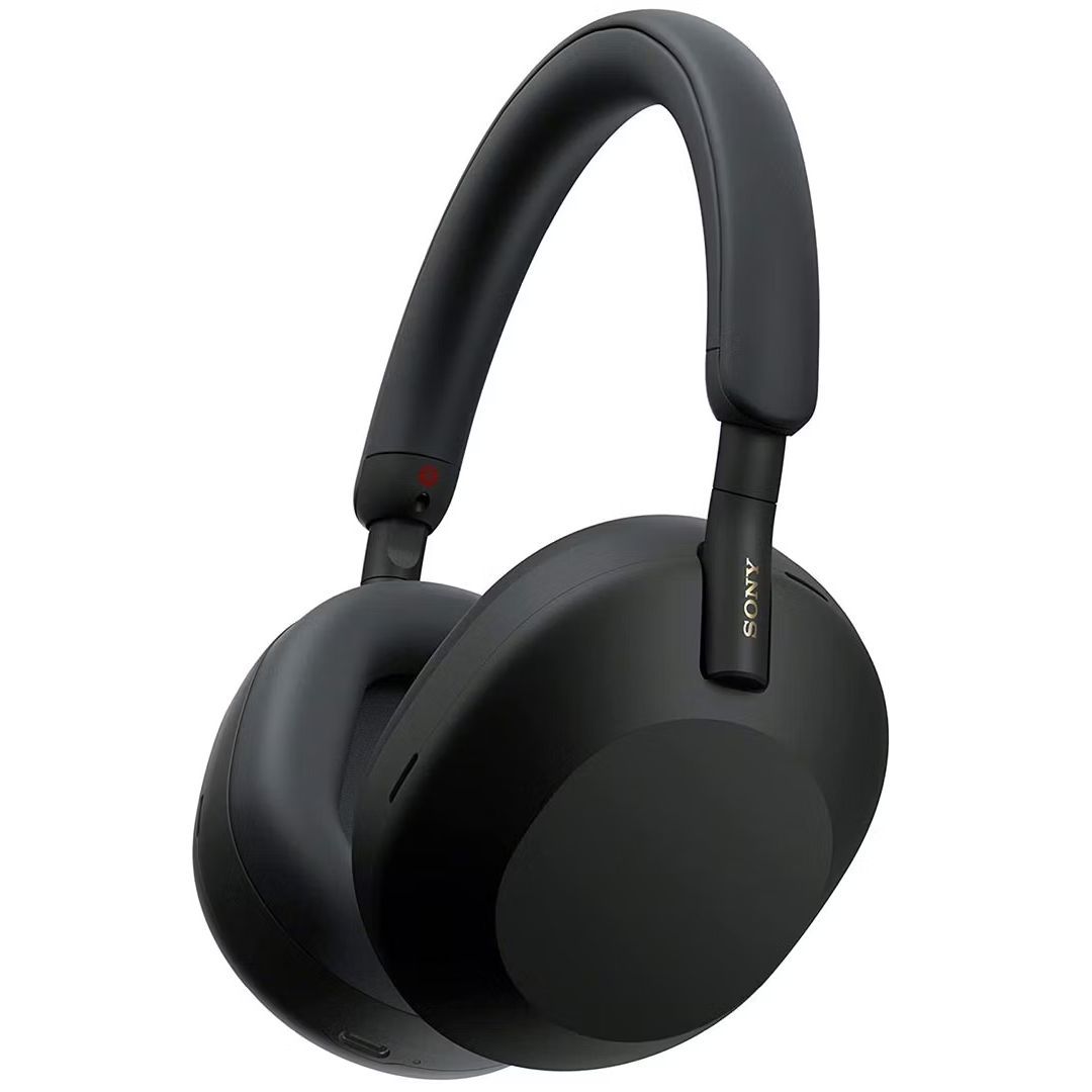 Black Sony WH-1000XM5 over-ear headphones positioned at an angle on white background